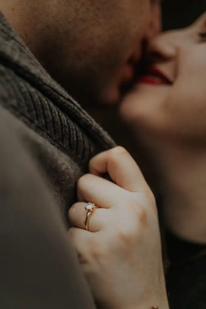 Engagement Portraits: her ring hand resting on his shoulder, close in, during their engagement session