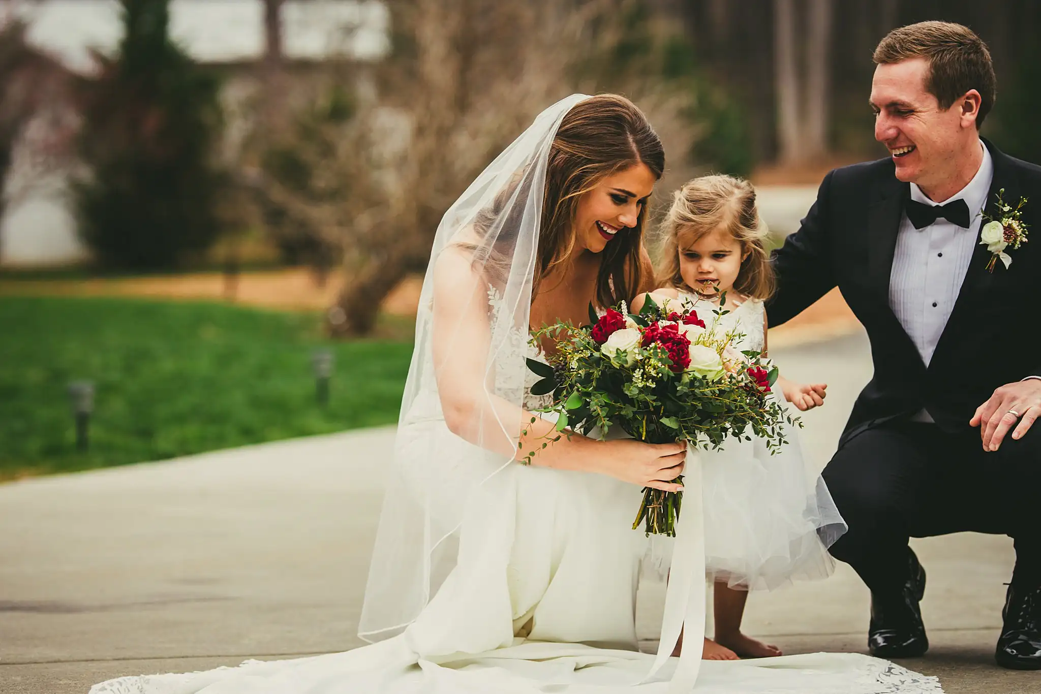 2019-04-22_0033.jpg Wedding Formals: the couple crouching with the flower girl, at their wedding at Little River Farms in Milton, GA