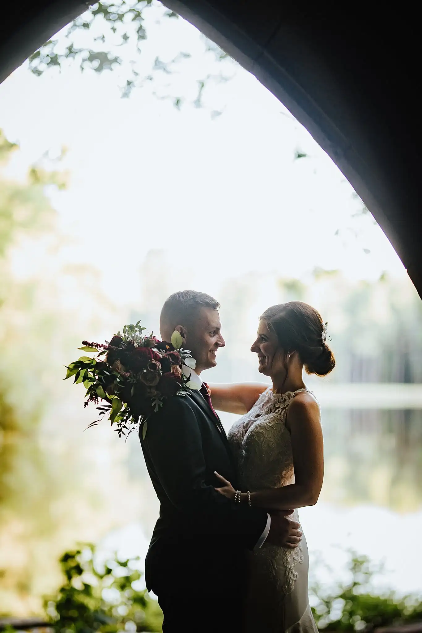 Wedding Formals: the couple silhouetted in the chapel archway, at their wedding at Callaway Gardens in Pine Mountain, GA