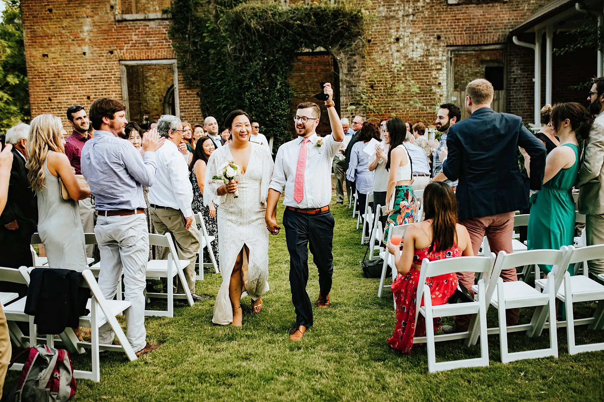 AtlantaWeddingPhotographers_0490.jpg Recessional: the couple coming back up the aisle as the guests cheer, at their wedding at Barnsley Gardens Resort in Adairsville, GA