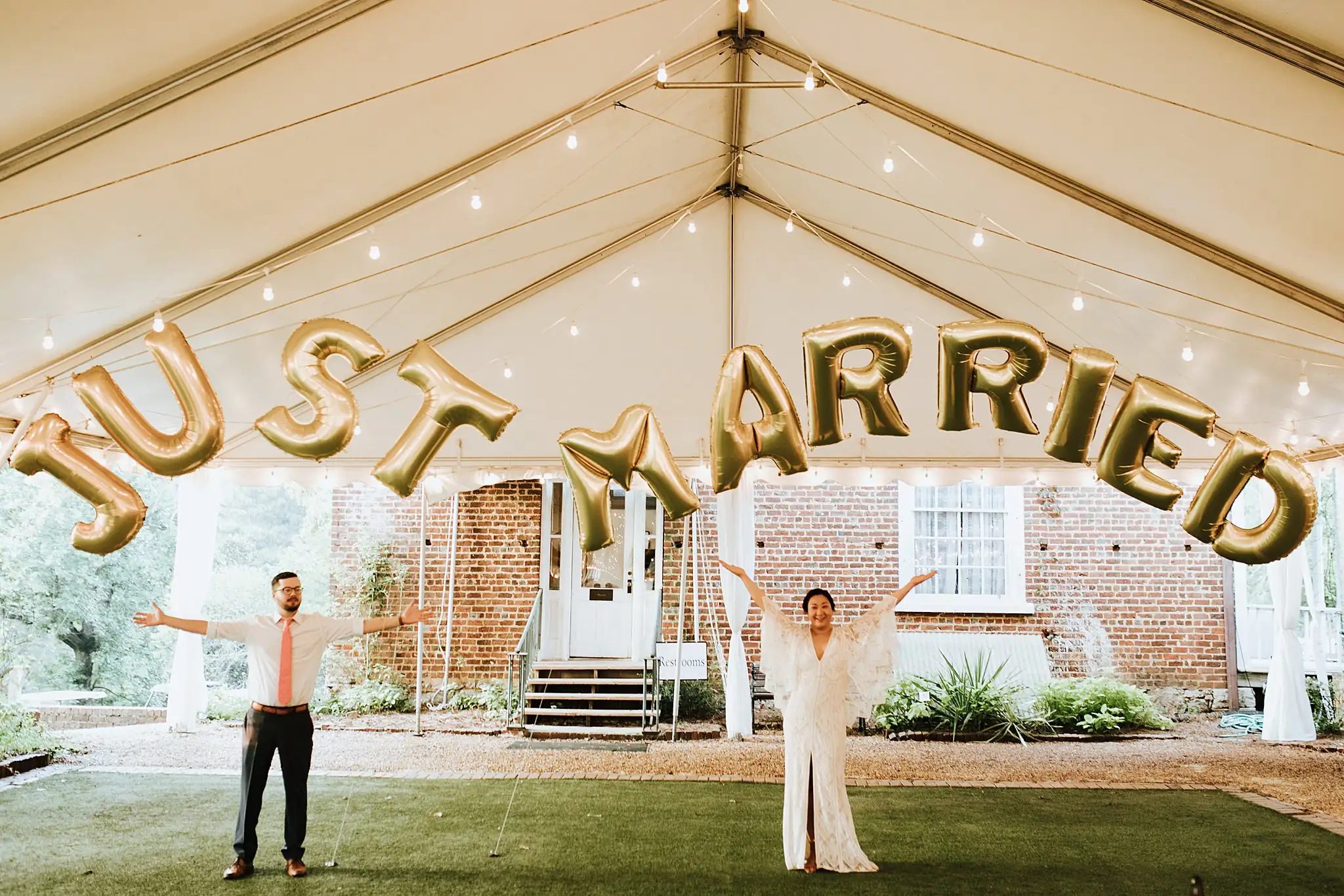 AtlantaWeddingPhotographers_0492.jpg Wedding Reception: the two of them under gold balloon letters on the lawn, at their wedding at Barnsley Gardens Resort in Adairsville, GA