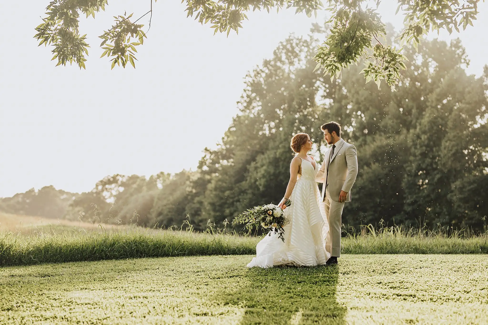 AtlantaWeddingPhotographers_0506.jpg Wedding Formals: the two of them walking the hayfield in the haze, at a Wedding styled shoot at The Venue at Murphy Lane in Newnan, GA