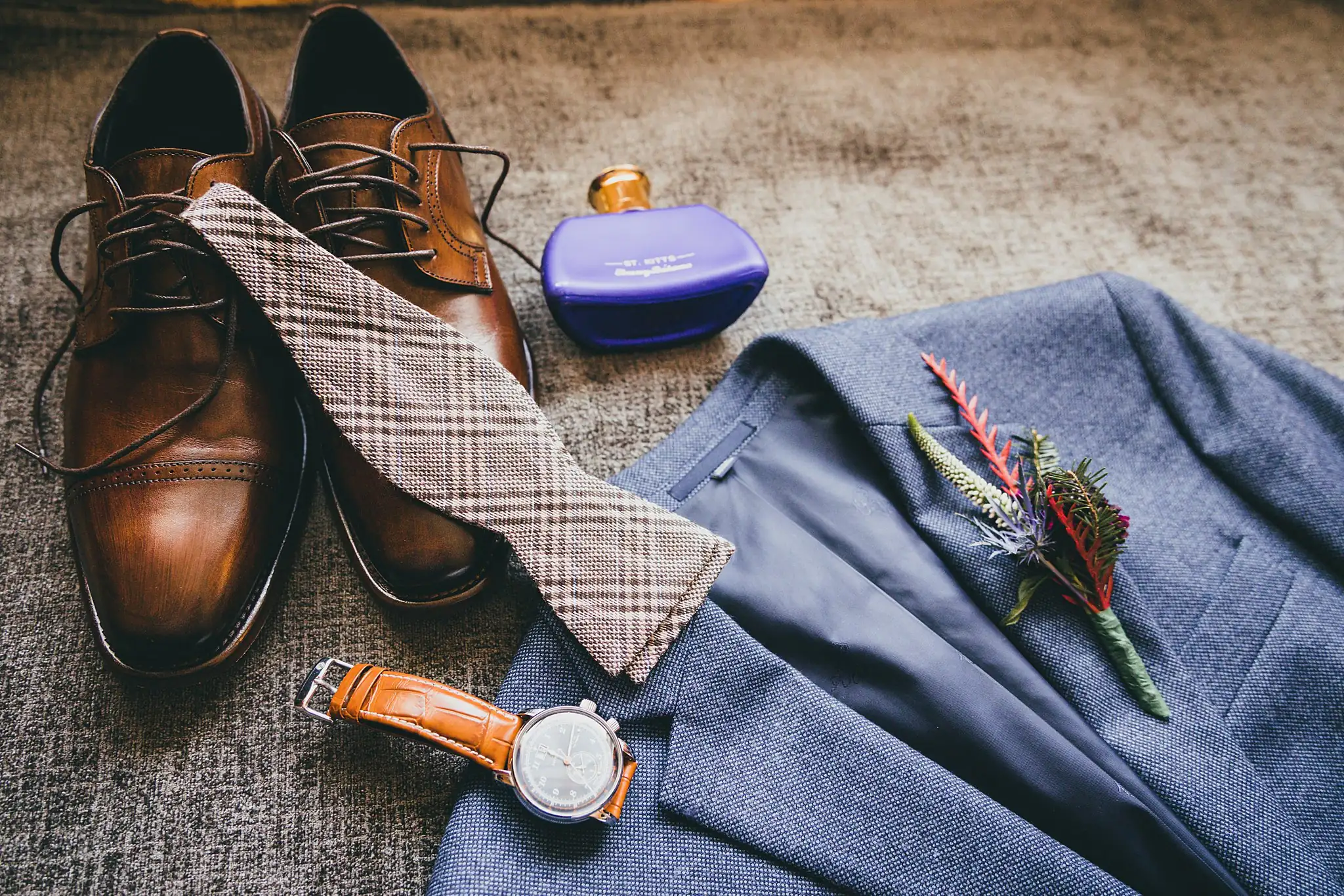 Wedding Details: the groom's shoes, bow tie and watch on his blue suit, at a wedding at the Westside Warehouse in Atlanta, GA