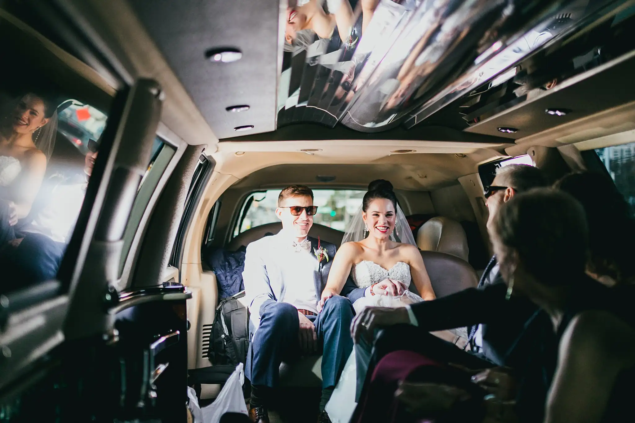 Wedding Formals: the couple riding in the limousine, at their wedding at the Westside Warehouse in Atlanta, GA