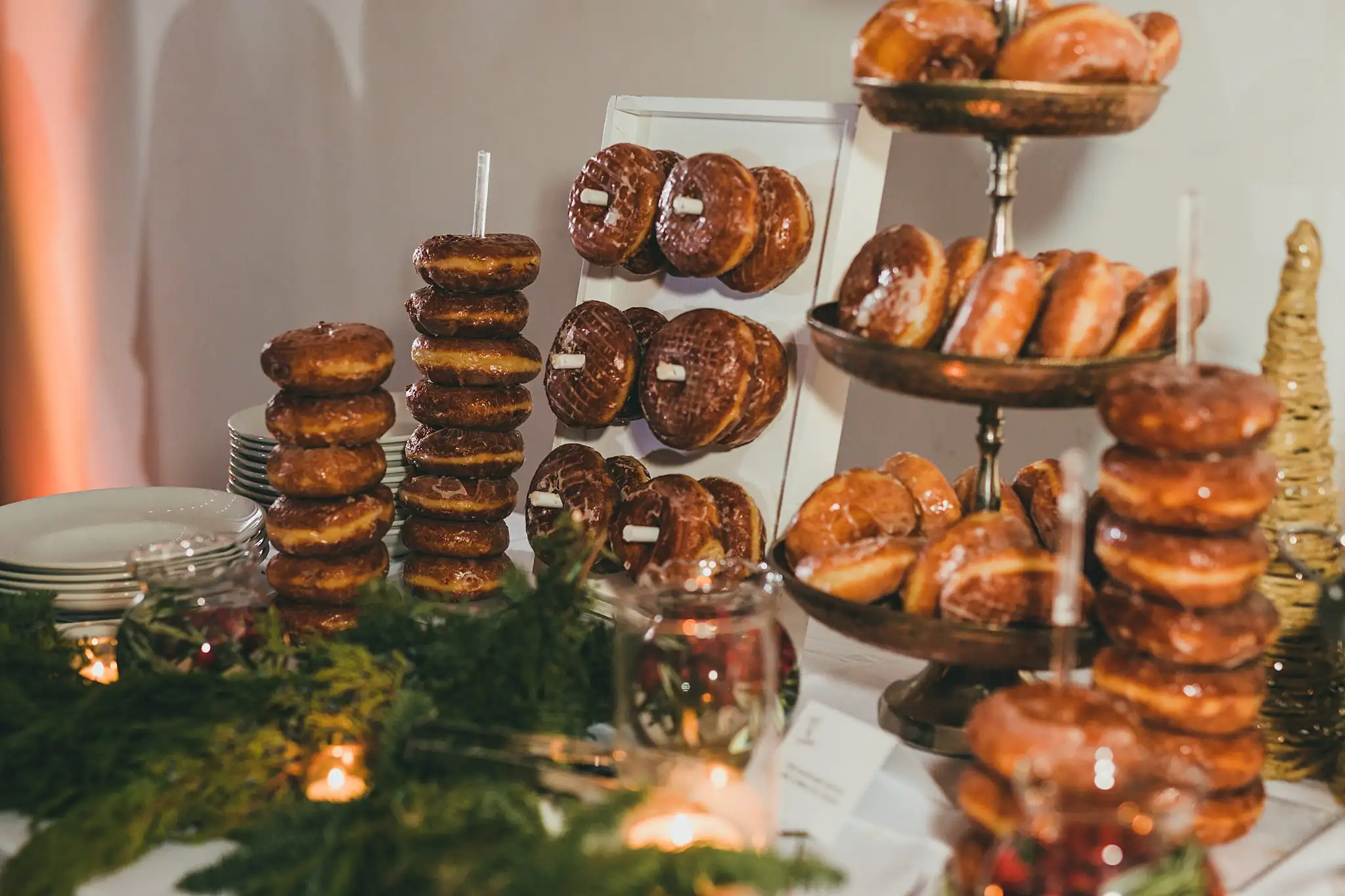 Wedding Cake Details: the tower of doughnuts on the dessert table, at their wedding at the Westside Warehouse in Atlanta, GA