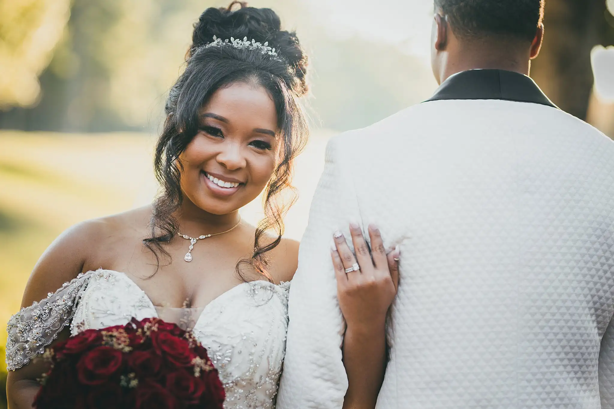AtlantaWeddingPhotographers_0676.jpg Wedding Formals: the bride smiling with her hand on his shoulder, at their wedding at the Country Club of the South in Johns Creek, GA