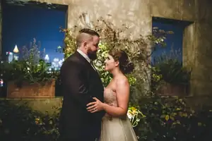 Wedding Formals: the two of them on a planted rooftop above the city, at a wedding