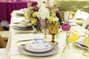 Colorful wedding tablescape styled by At The Altar Weddings & Events