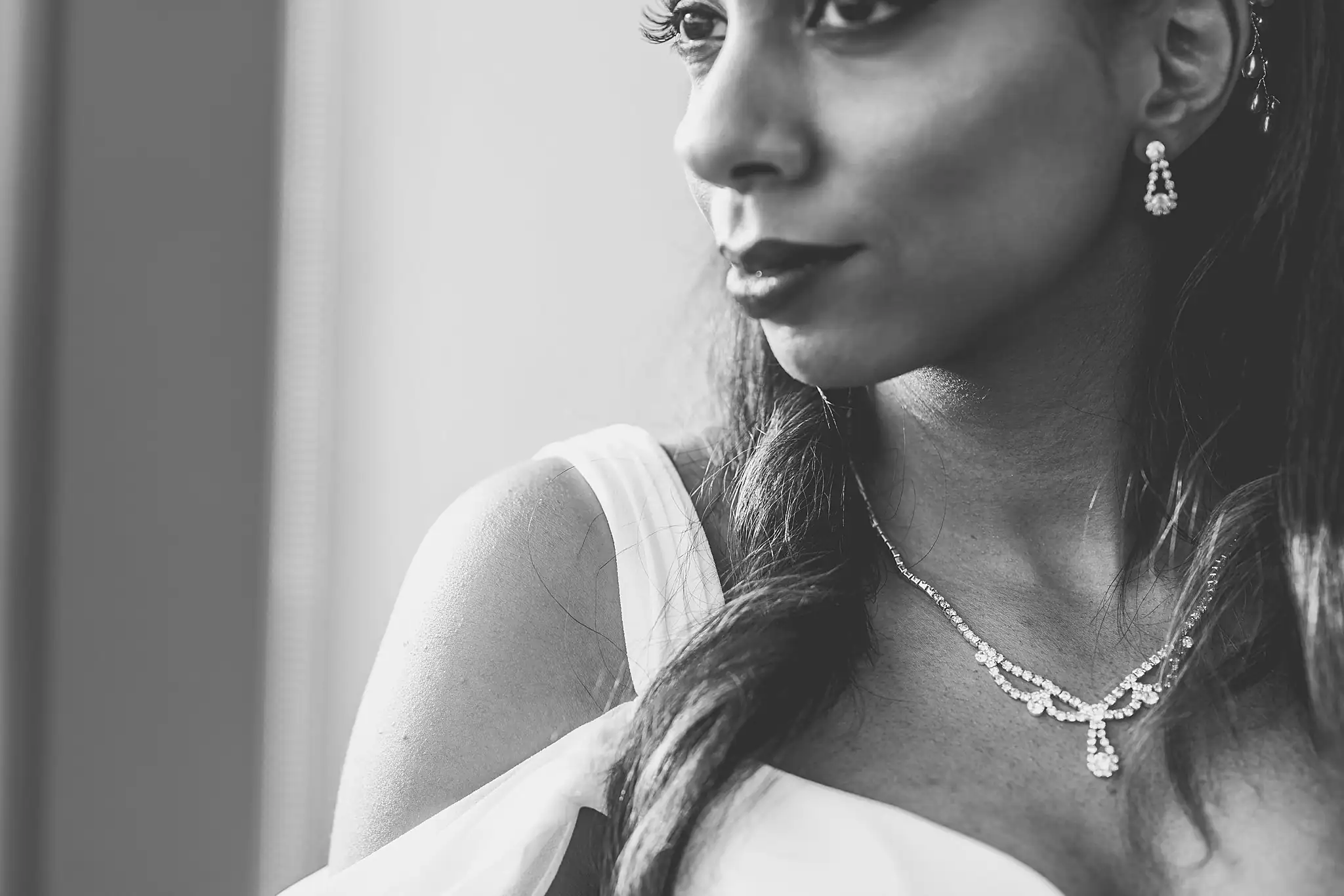 Bridal Portraits: the bride's diamond necklace, in black and white, at their elopement at Ventanas in Atlanta, GA