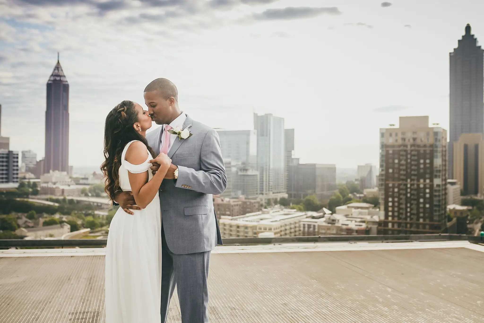 Wedding Formals: the couple close together, the skyline behind them, at their elopement at Ventanas in Atlanta, GA