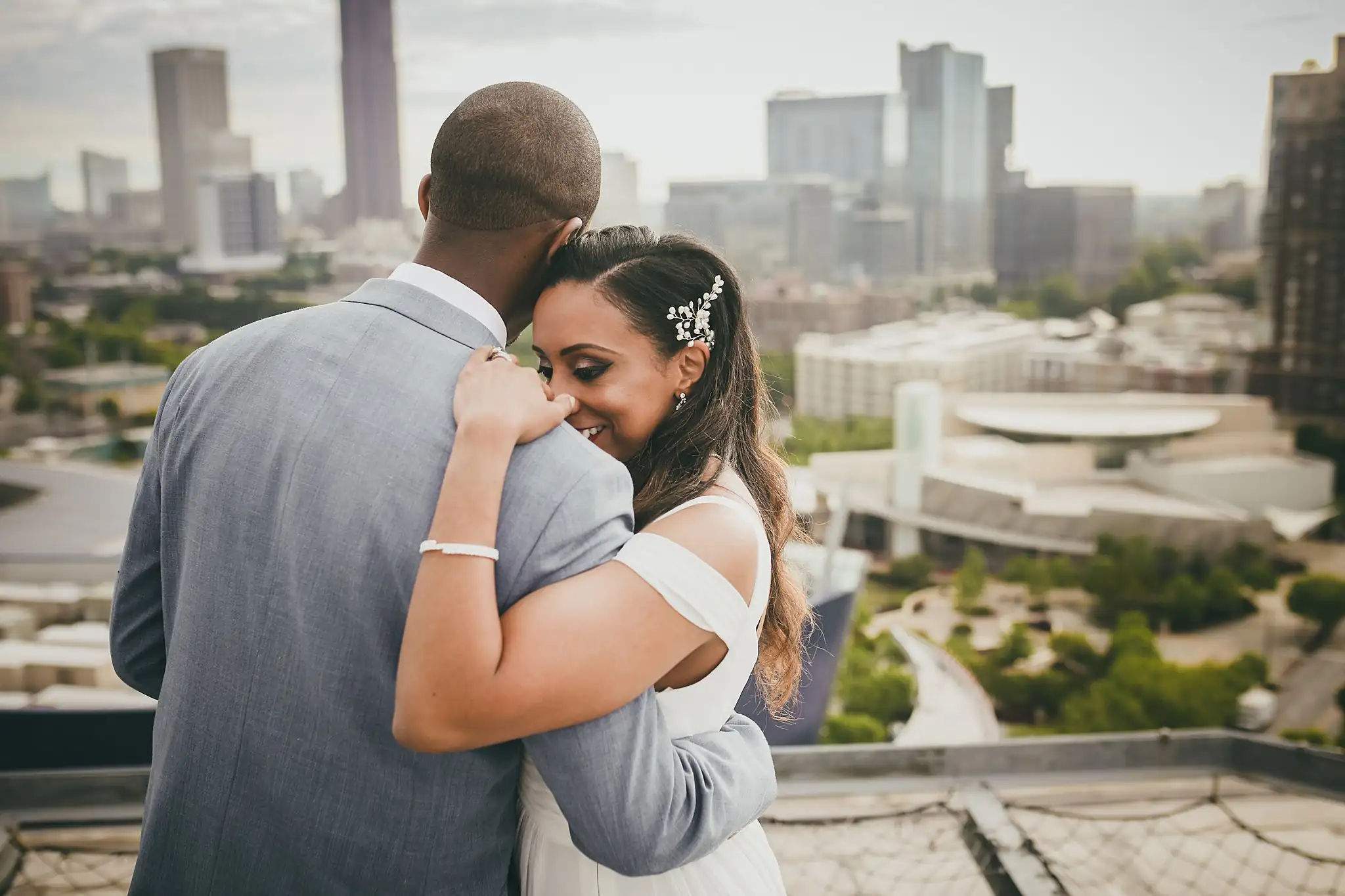 Wedding Formals: the bride resting her head on the groom's shoulder, at their elopement at Ventanas in Atlanta, GA