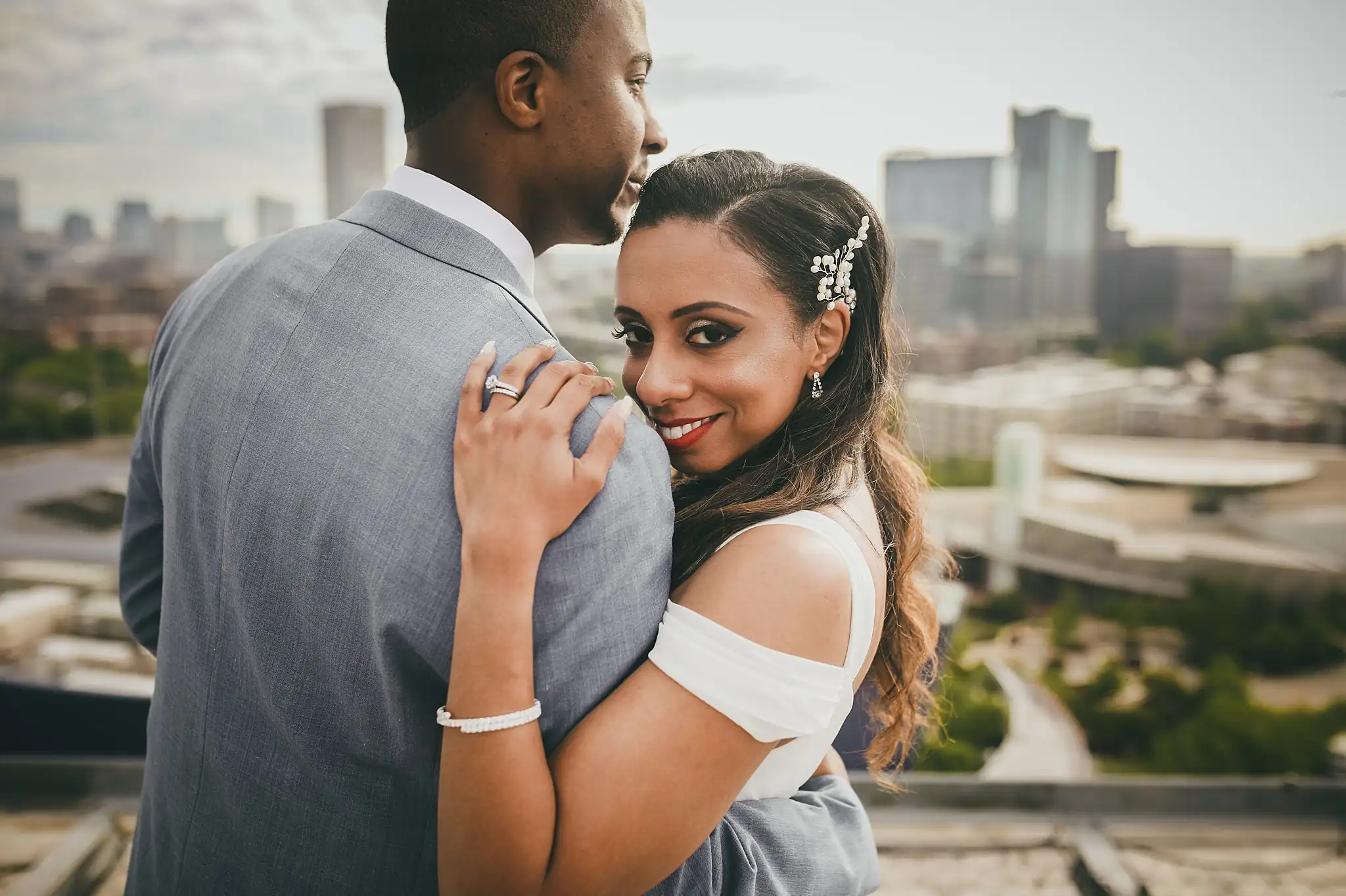 Wedding Formals: the bride looking back over the groom's shoulder, at their elopement at Ventanas in Atlanta, GA