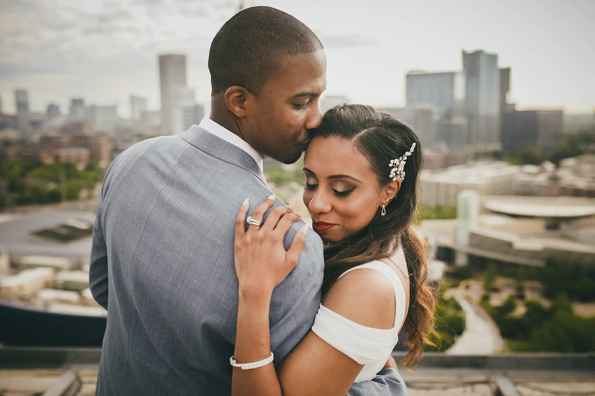 Wedding Formals: the groom kissing the bride's forehead, her hand on his chest, at their elopement at Ventanas in Atlanta, GA