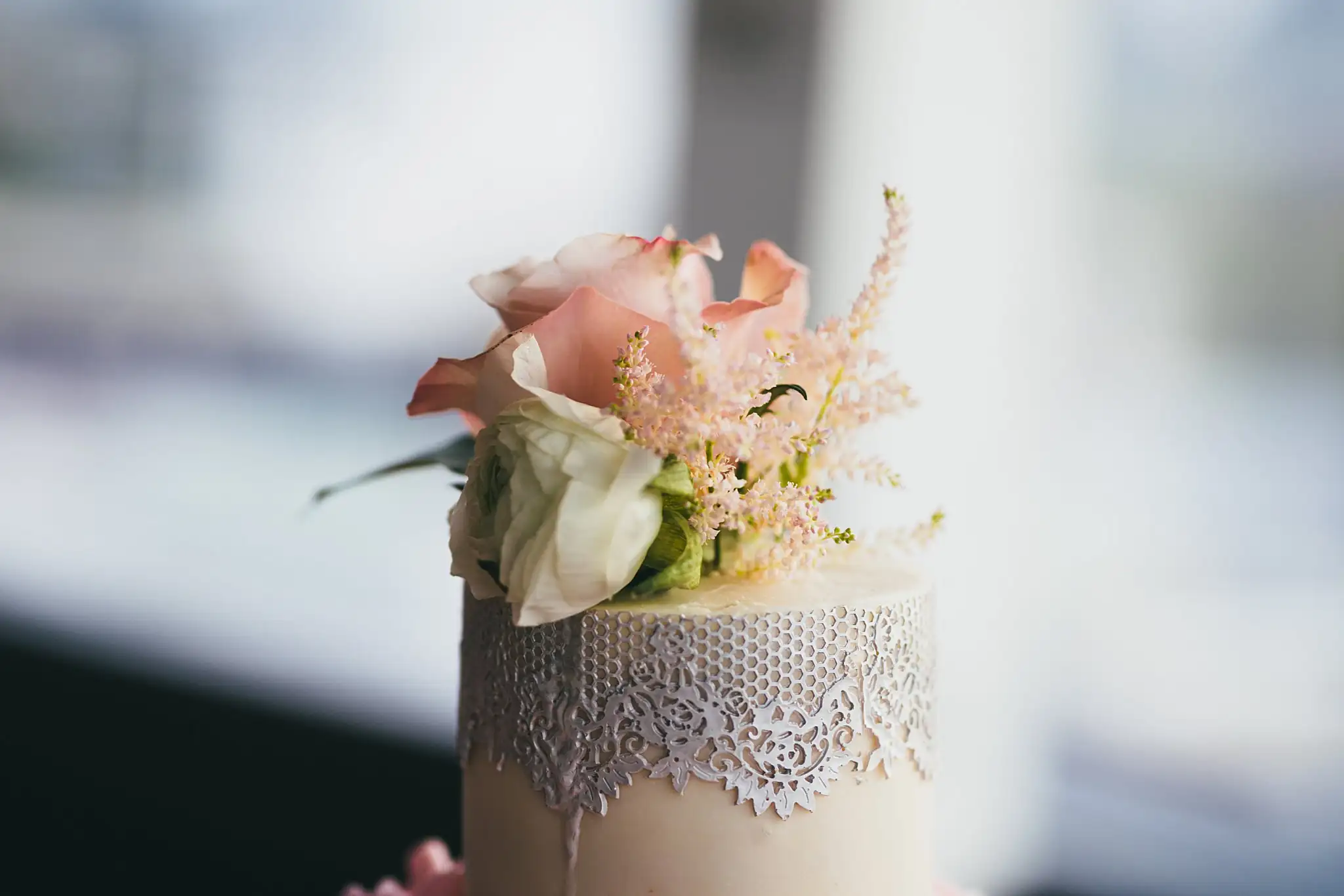 Wedding Cake Details: the flowers set on the top tier of the cake, at an elopement at Ventanas in Atlanta, GA
