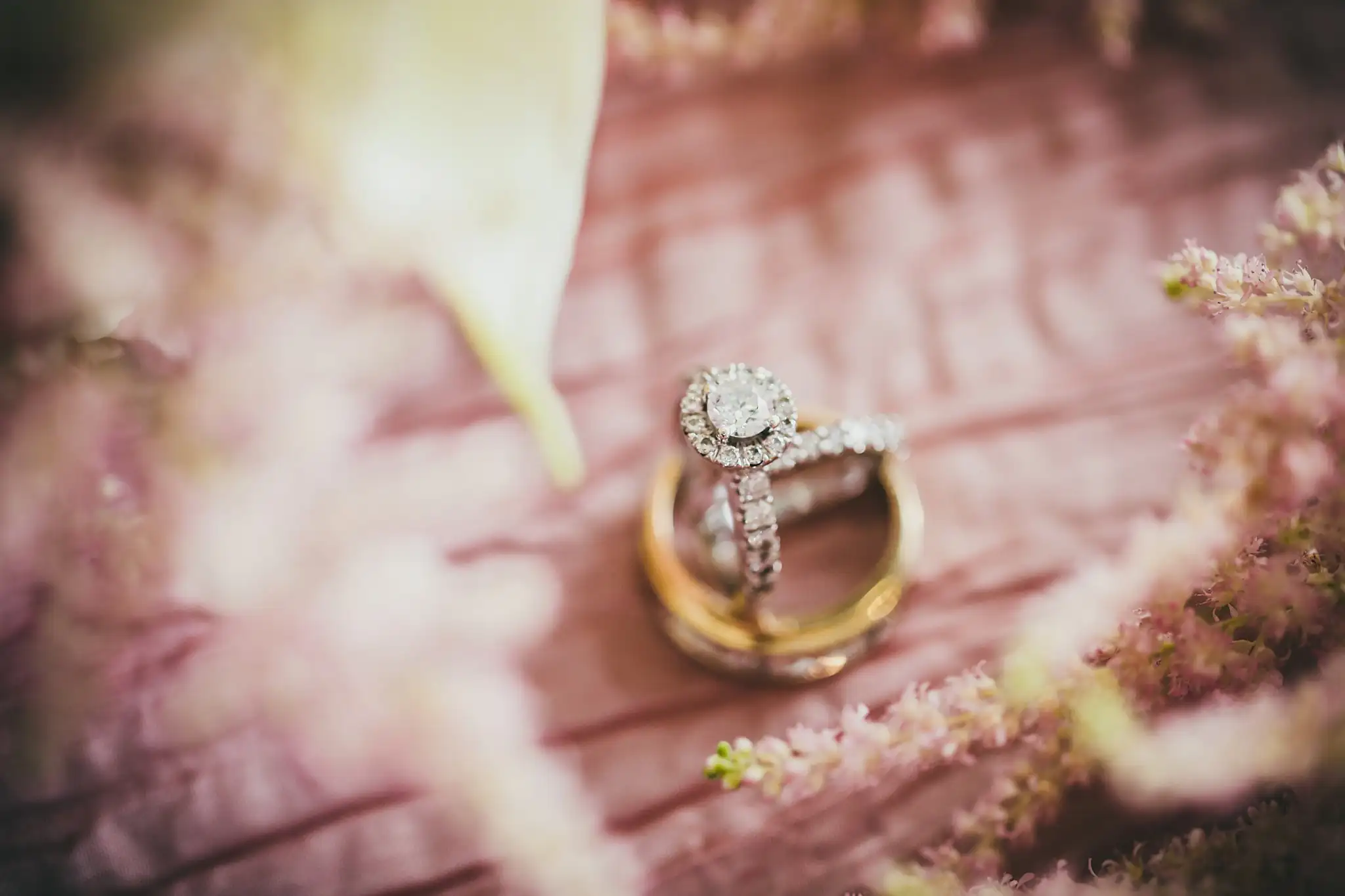 Wedding Details: the engagement ring and the wedding bands on the blush linen, at an elopement at Ventanas in Atlanta, GA