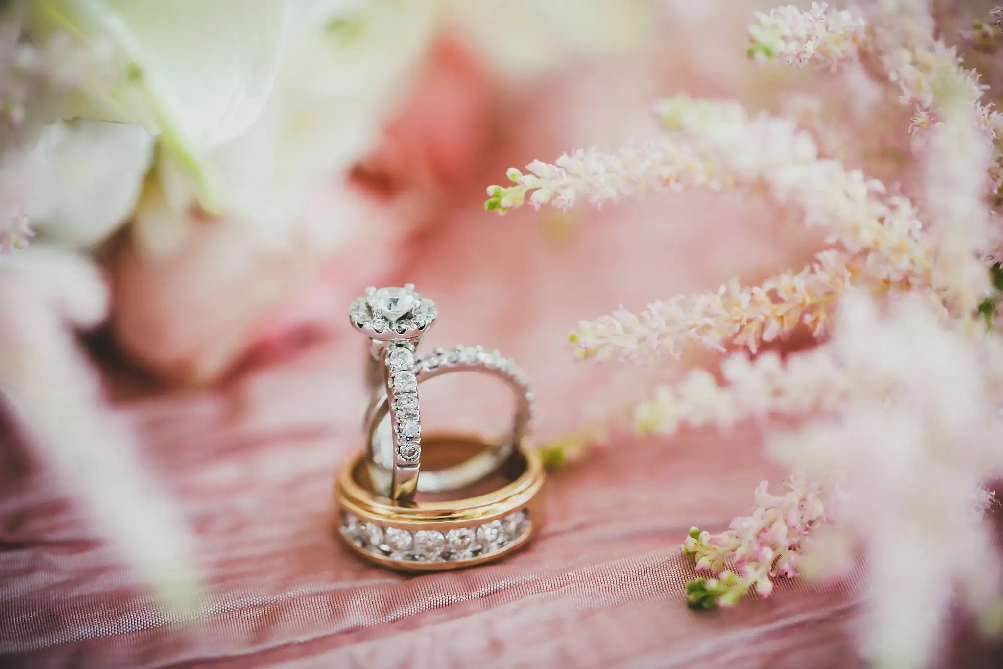 Wedding Details: the engagement ring stacked on the wedding bands among the astilbe, at an elopement at Ventanas in Atlanta, GA