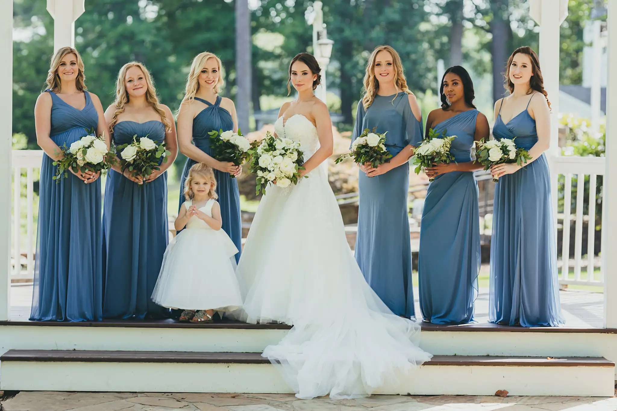 Wedding Party: the bride with her bridesmaids on the porch, at their wedding at Little River Farms in Milton, GA