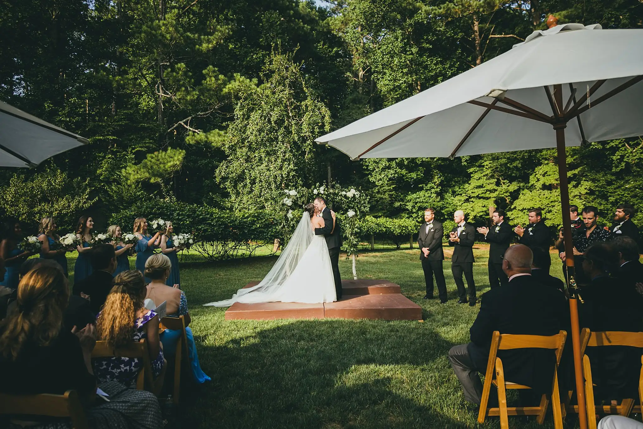 Wedding Ceremony: the ceremony from among the guests, at their wedding at Little River Farms in Milton, GA