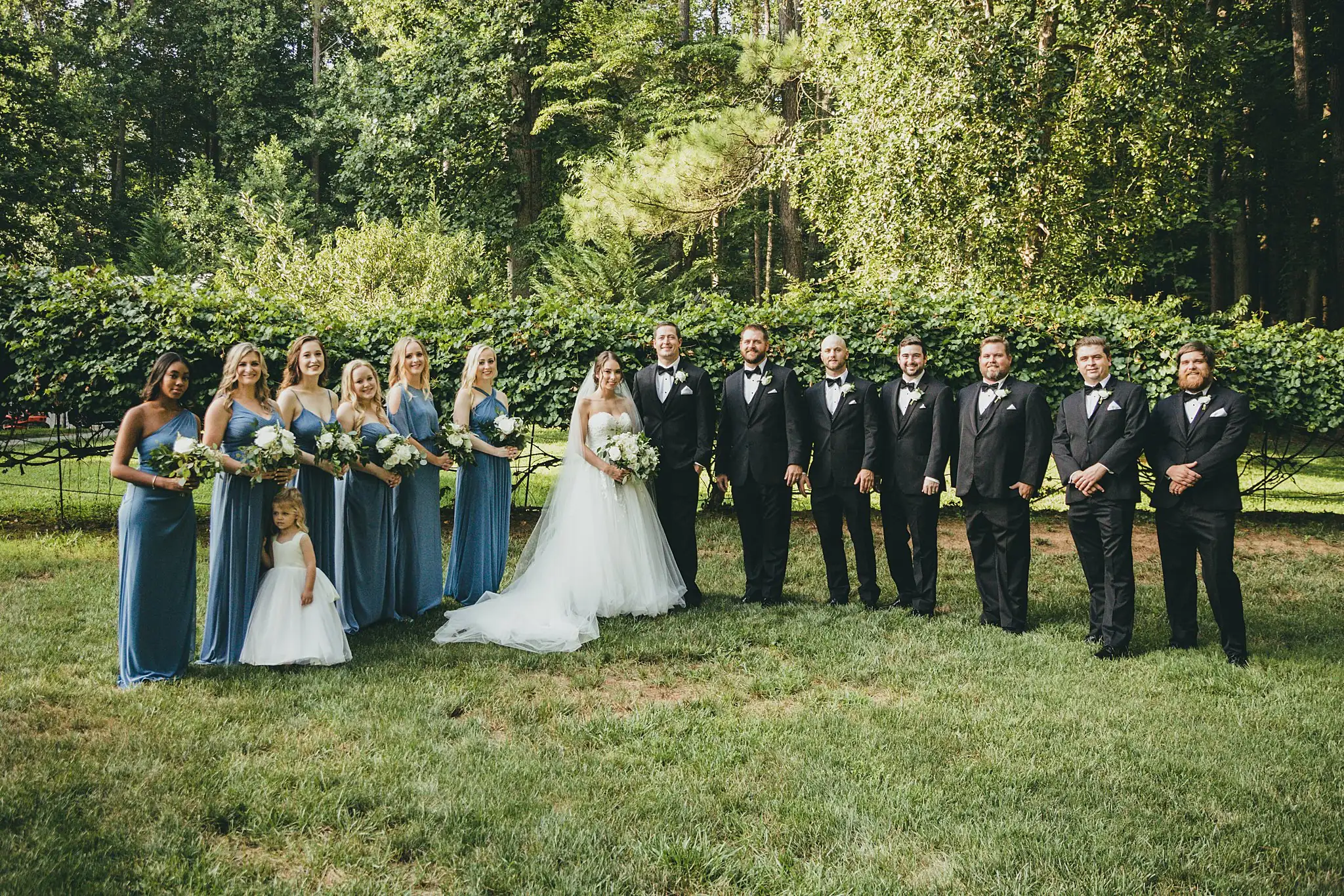 Wedding Party: the whole bridal party on the lawn, at their wedding at Little River Farms in Milton, GA