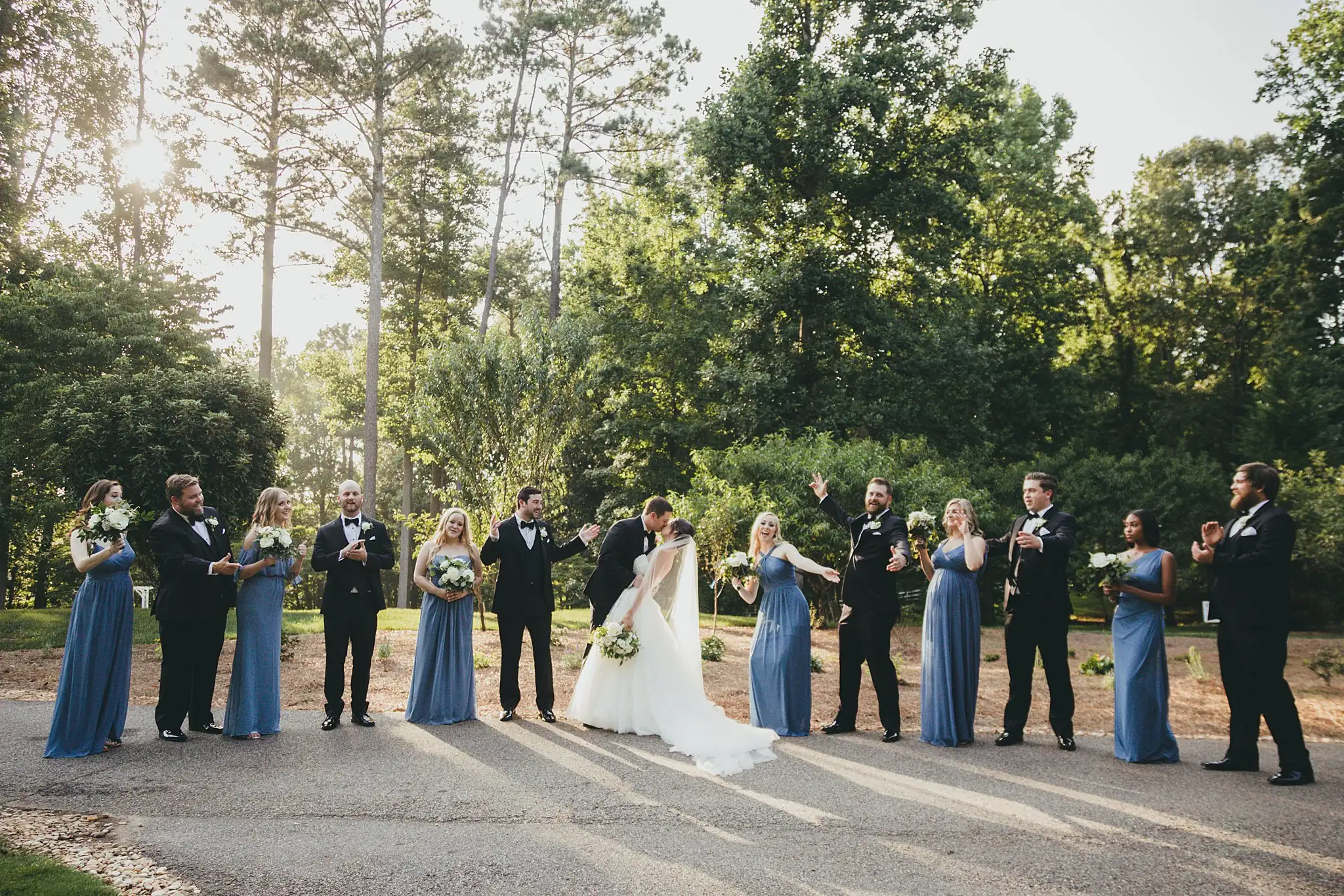 Wedding Party: the bridal party cheering on the drive, at their wedding at Little River Farms in Milton, GA