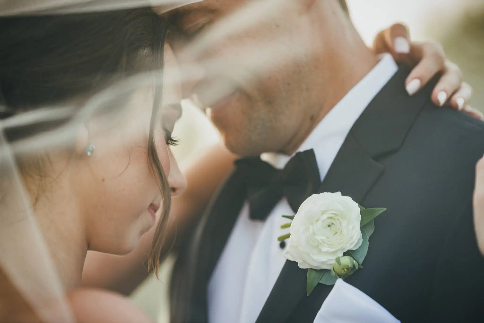 Wedding Formals: the couple seen through her veil, at their wedding at Little River Farms in Milton, GA