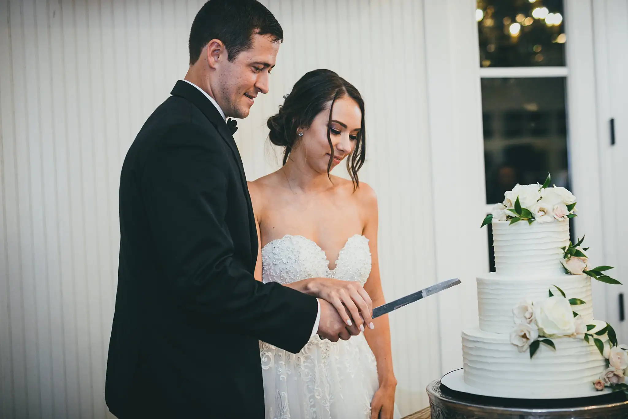 Cake Cutting: the couple cutting their cake, at their wedding at Little River Farms in Milton, GA