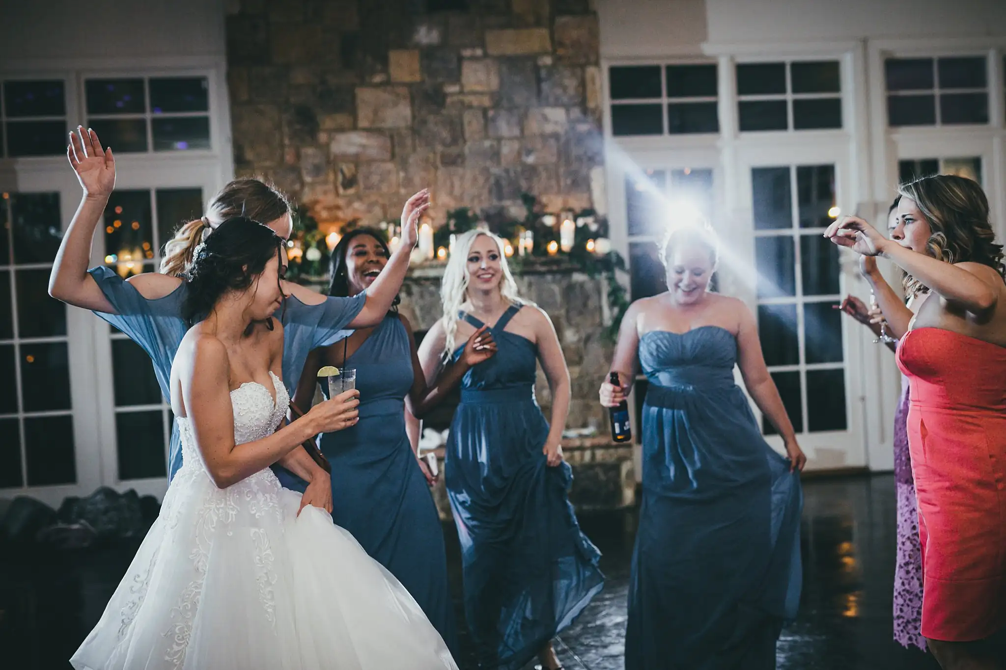 Wedding Reception: the bride dancing with her bridesmaids, at their wedding at Little River Farms in Milton, GA