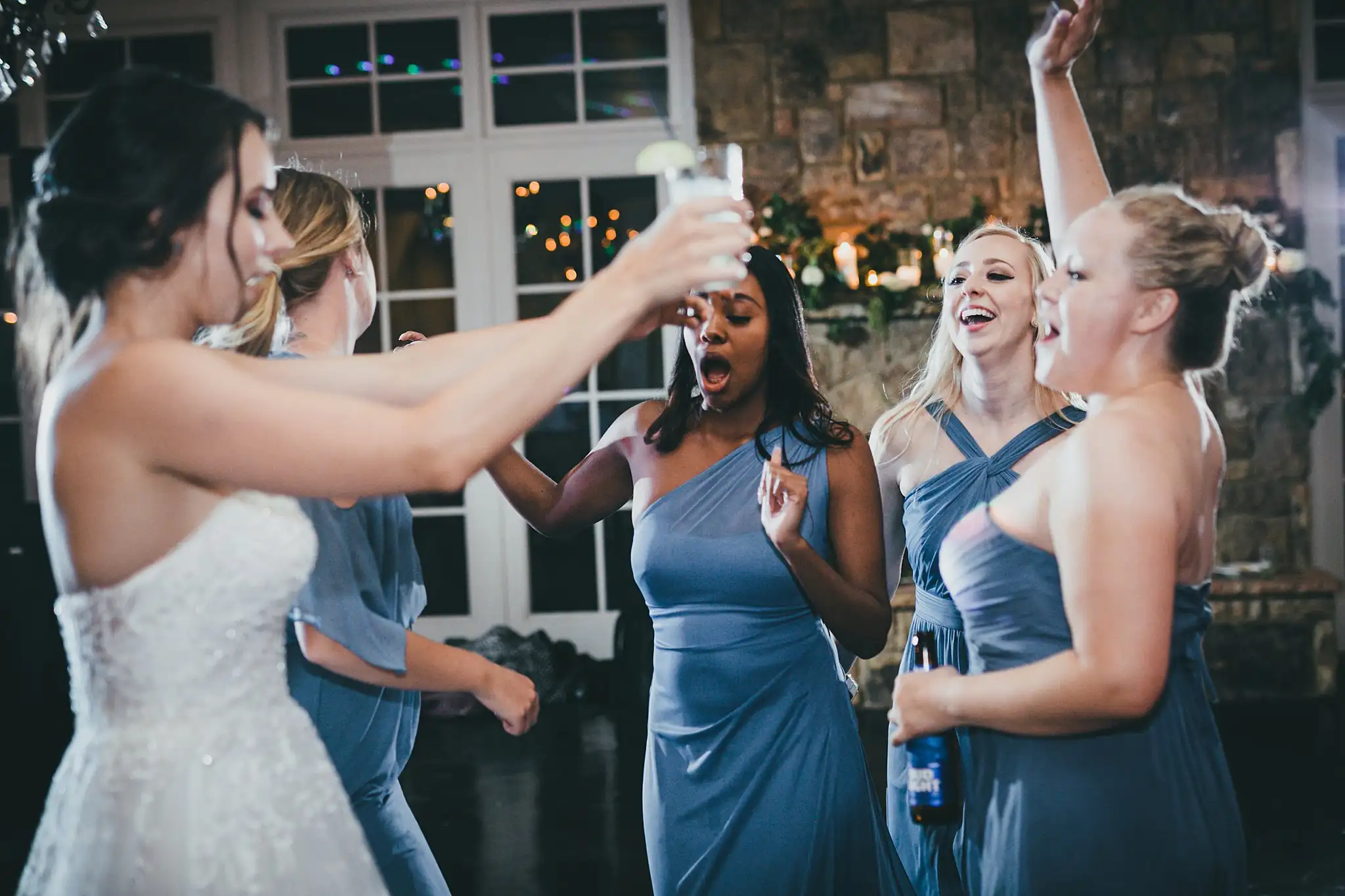 Wedding Reception: the bride and bridesmaids singing together, at their wedding at Little River Farms in Milton, GA