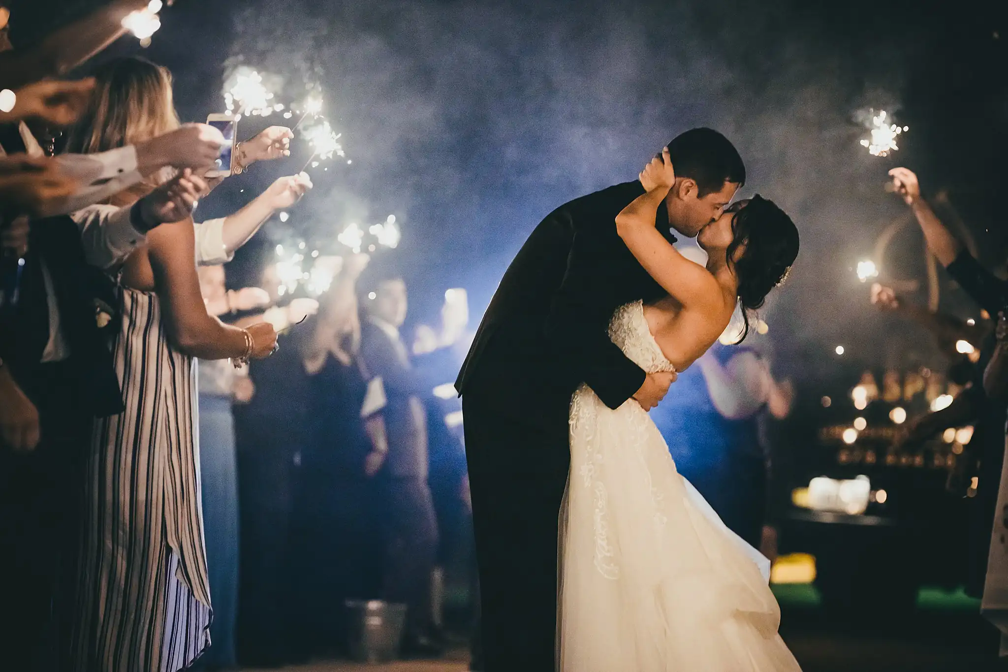 Sparkler Exit: the groom dipping the bride amid the sparklers, at their wedding at Little River Farms in Milton, GA