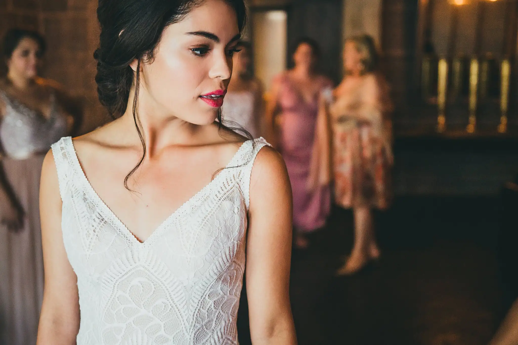 Getting Ready: the bride dressed, bridesmaids behind her, before their wedding at the Piedmont Garden Tent in Atlanta, GA