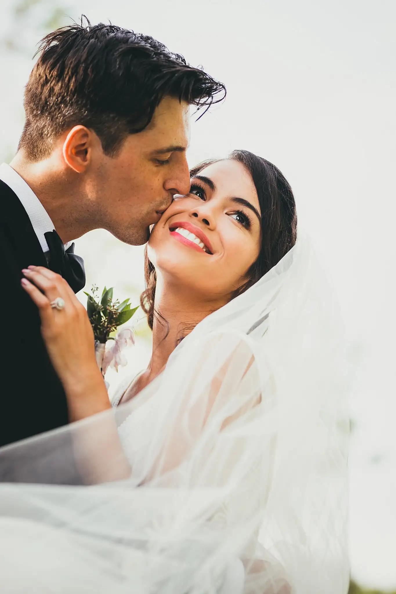 Wedding Formals: the groom kissing her cheek beneath the veil, at their wedding at the Piedmont Garden Tent in Atlanta, GA