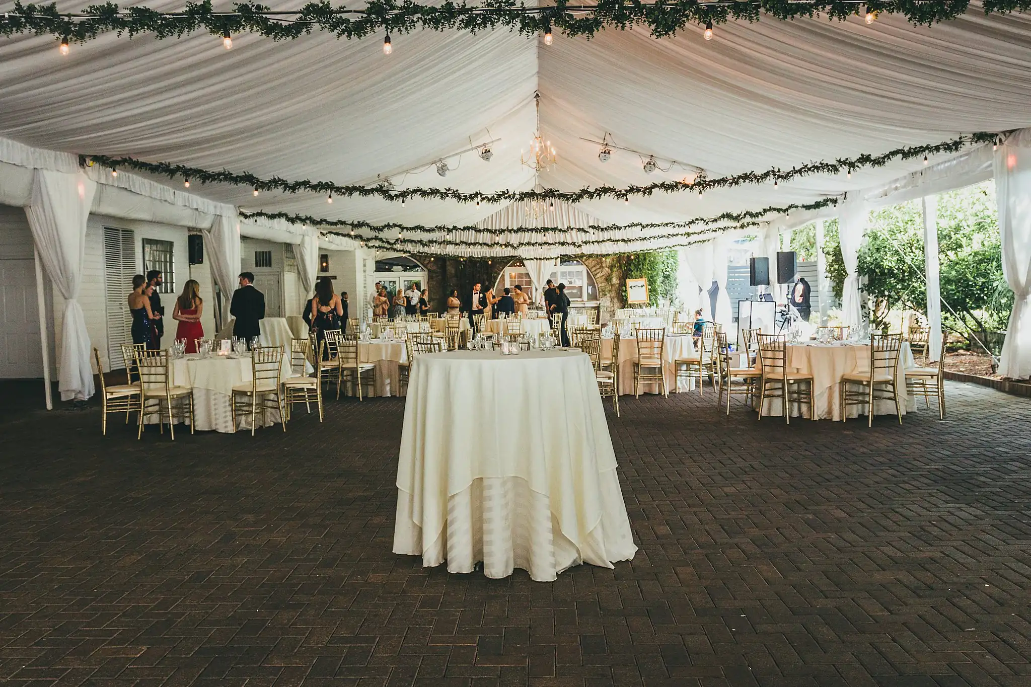 Reception Details: the draped tent hung with string lights, at their wedding at the Piedmont Garden Tent in Atlanta, GA