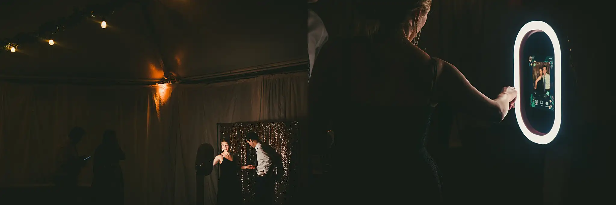 Reception Details: the photo booth light in the dark, at their wedding at the Piedmont Garden Tent in Atlanta, GA