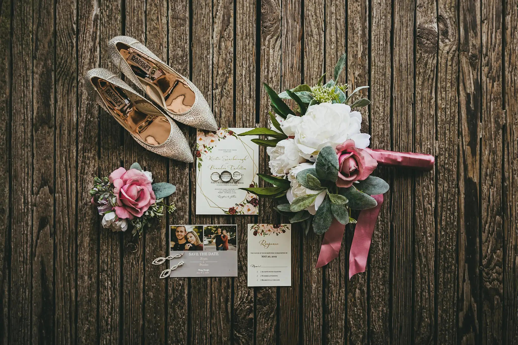 Wedding Details: the bride's heels, rings and invitation on weathered wood, at a wedding at Houston Lake Country Club in Perry, GA
