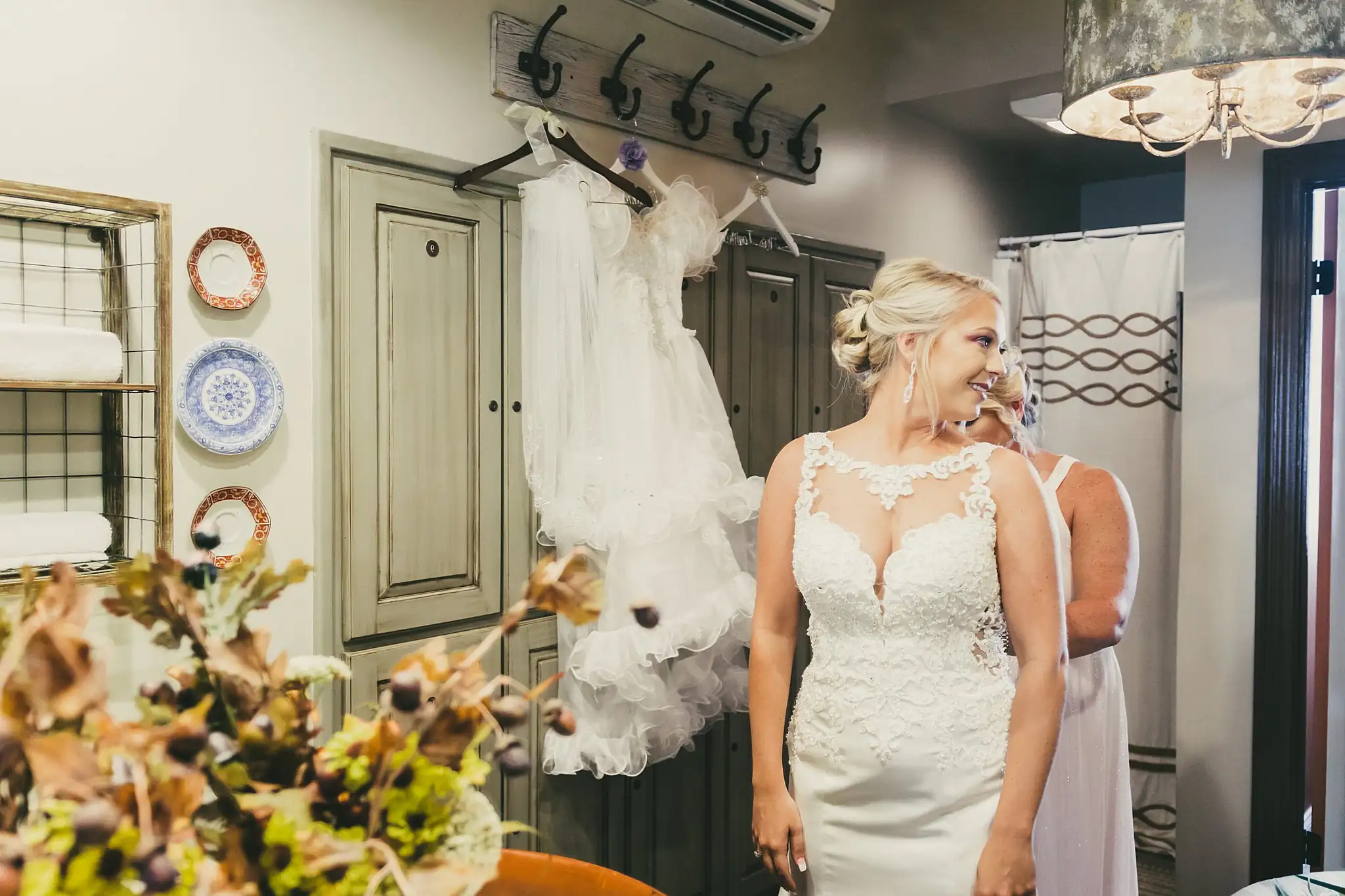 Getting Ready: the bride in her gown in the getting-ready room, before their wedding at Houston Lake Country Club in Perry, GA