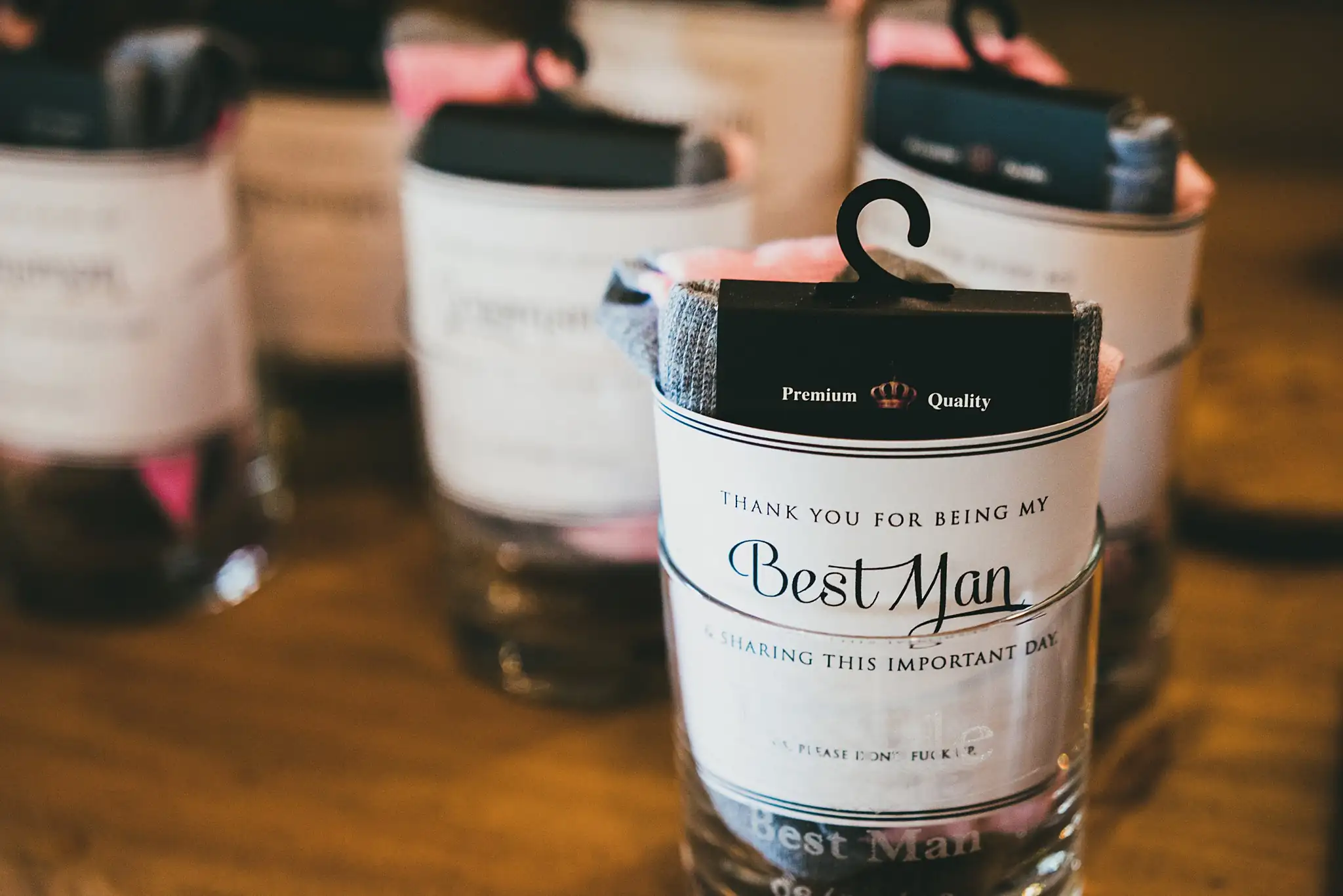 Wedding Details: a Best Man gift glass packed with socks, at a wedding at Houston Lake Country Club in Perry, GA