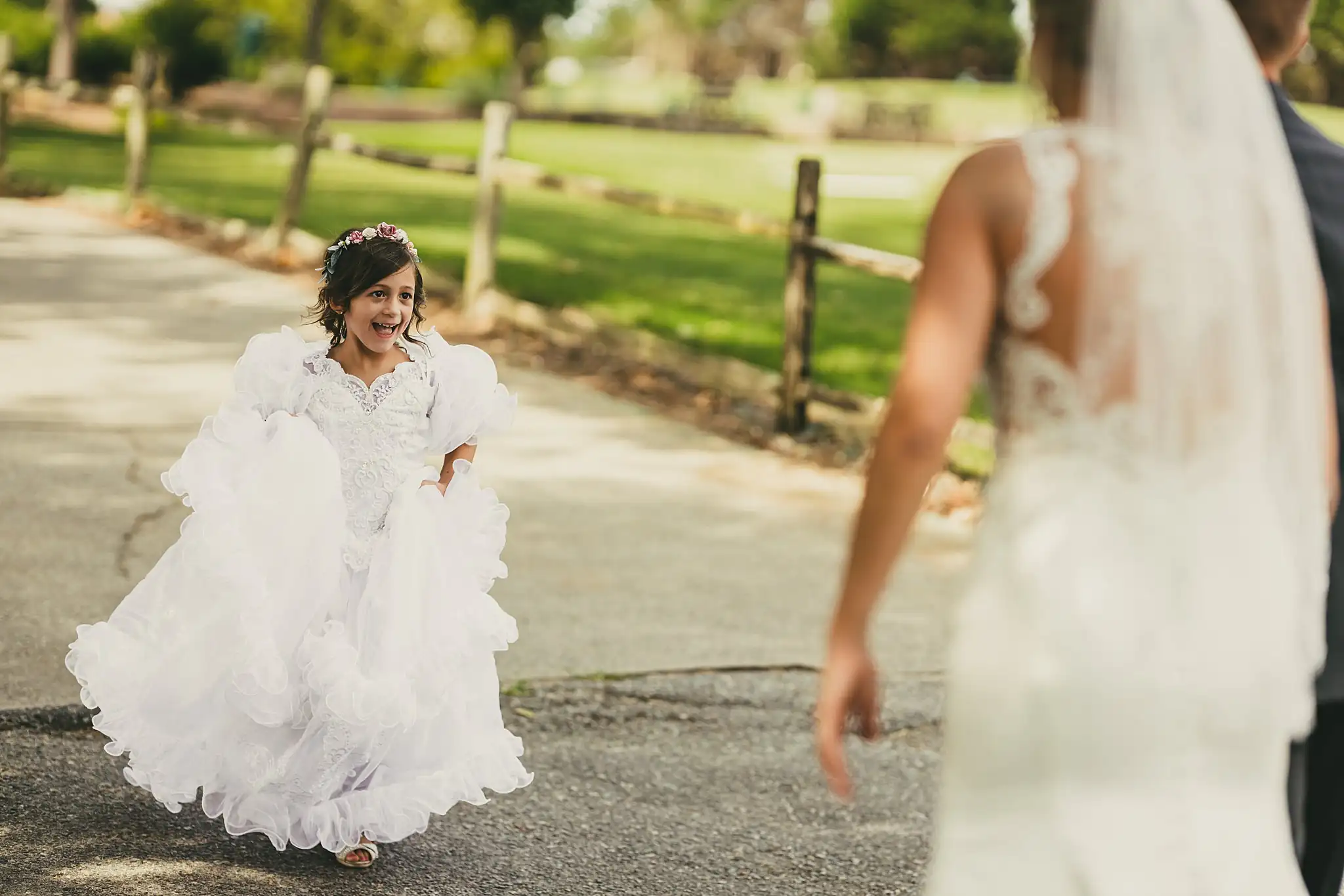 Getting Ready: a bridesmaid running in to see the bride, before their wedding at Houston Lake Country Club in Perry, GA