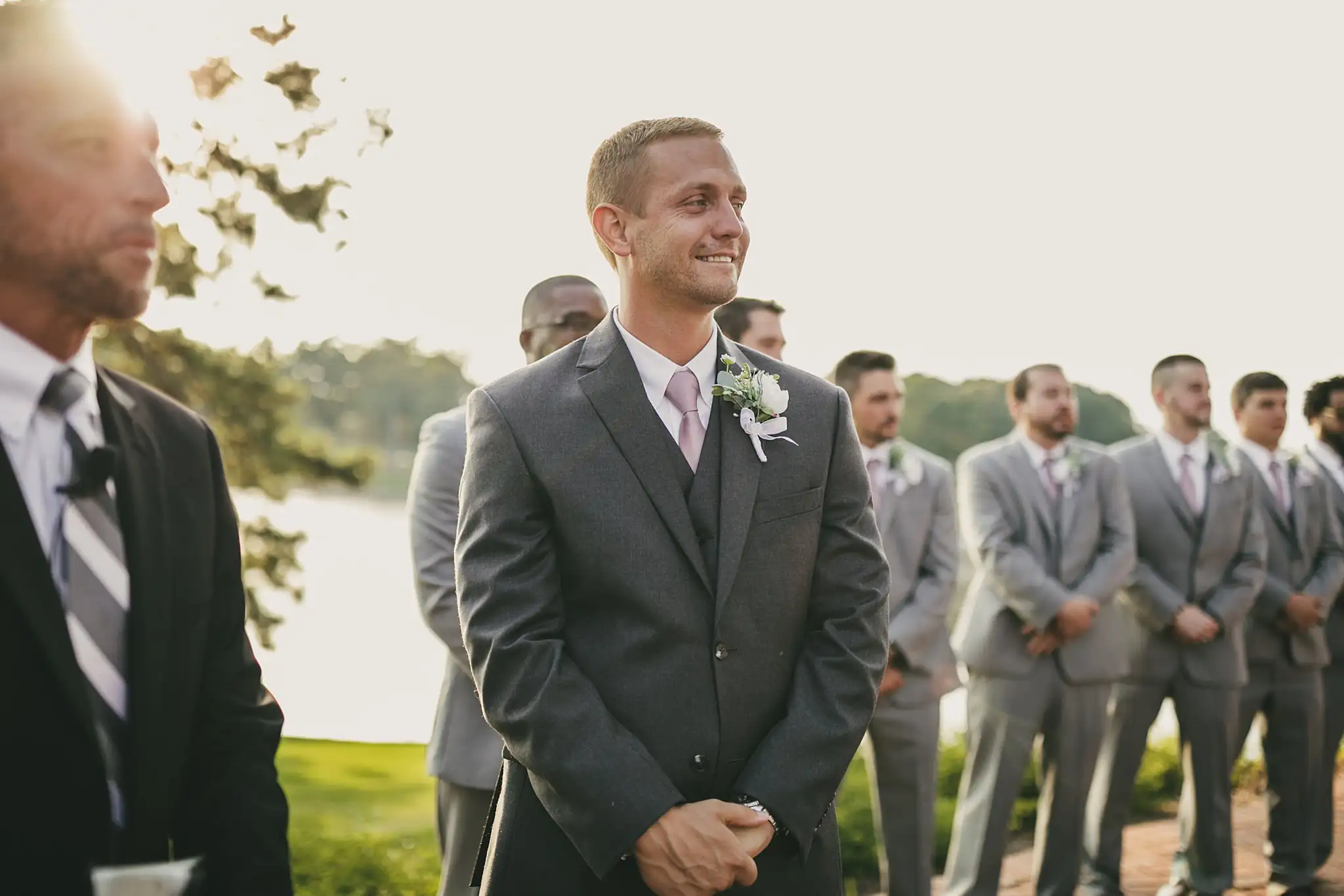 Wedding Ceremony: the groom watching for the bride, at their wedding at Houston Lake Country Club in Perry, GA