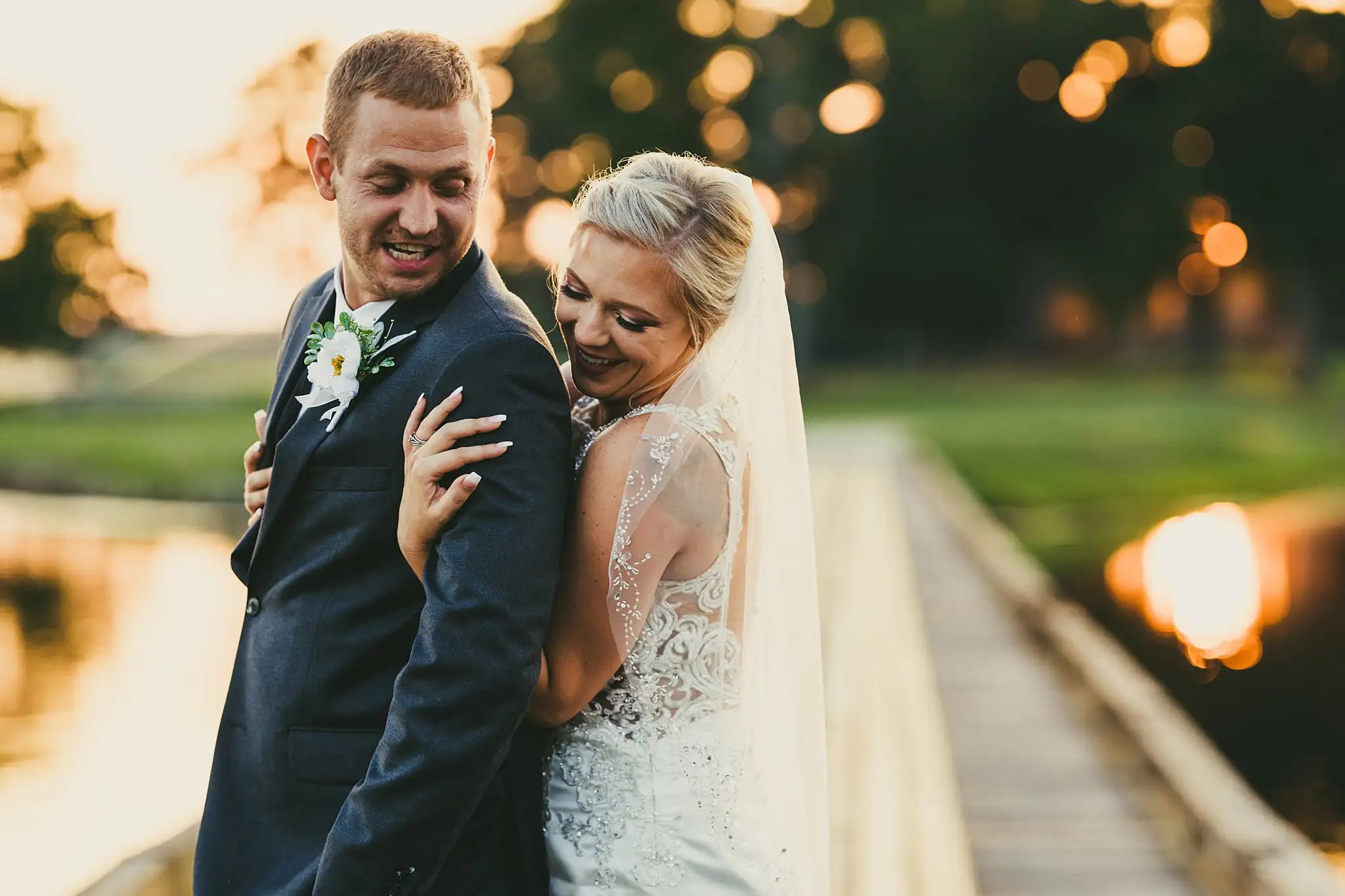Wedding Formals: the couple at golden hour beside the lake, at their wedding at Houston Lake Country Club in Perry, GA