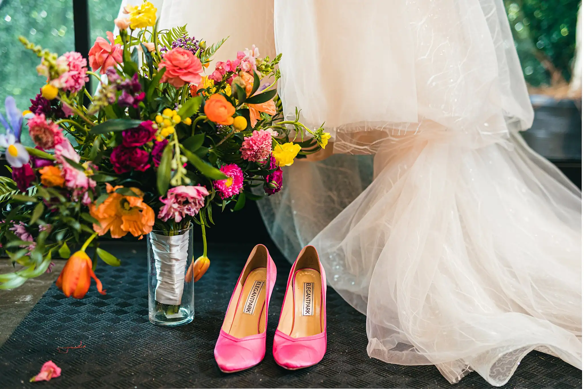 AtlantaWeddingPhotographers_1184.jpg Wedding Details: a spring arrangement beside pink heels, at a Whimsically in Love LGBTQ Wedding styled shoot at Brick and Ivey in Marietta, GA