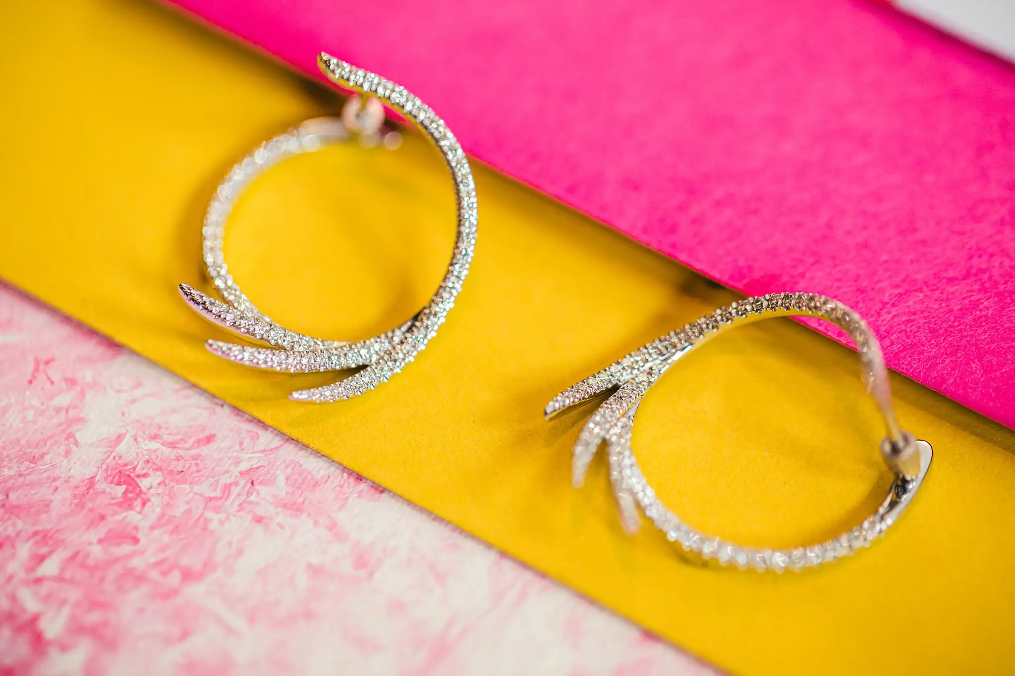 AtlantaWeddingPhotographers_1187.jpg Wedding Details: diamond hoop earrings on yellow and pink, at a Whimsically in Love LGBTQ Wedding styled shoot at Brick and Ivey in Marietta, GA