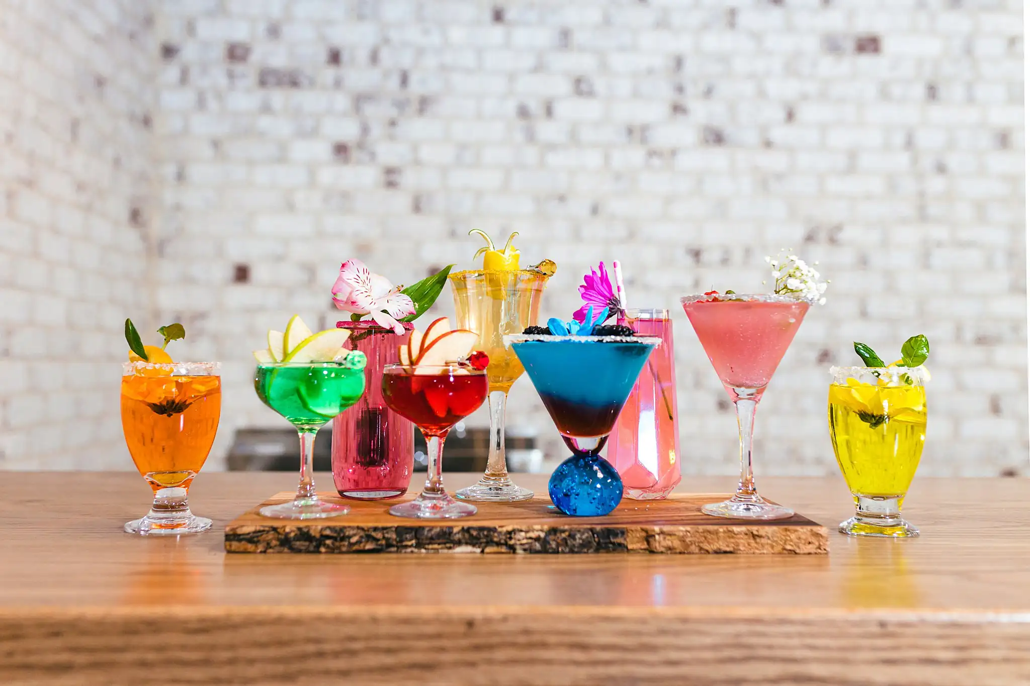 AtlantaWeddingPhotographers_1206.jpg Reception Details: a row of brightly coloured cocktails, at a Whimsically in Love LGBTQ Wedding styled shoot at Brick and Ivey in Marietta, GA