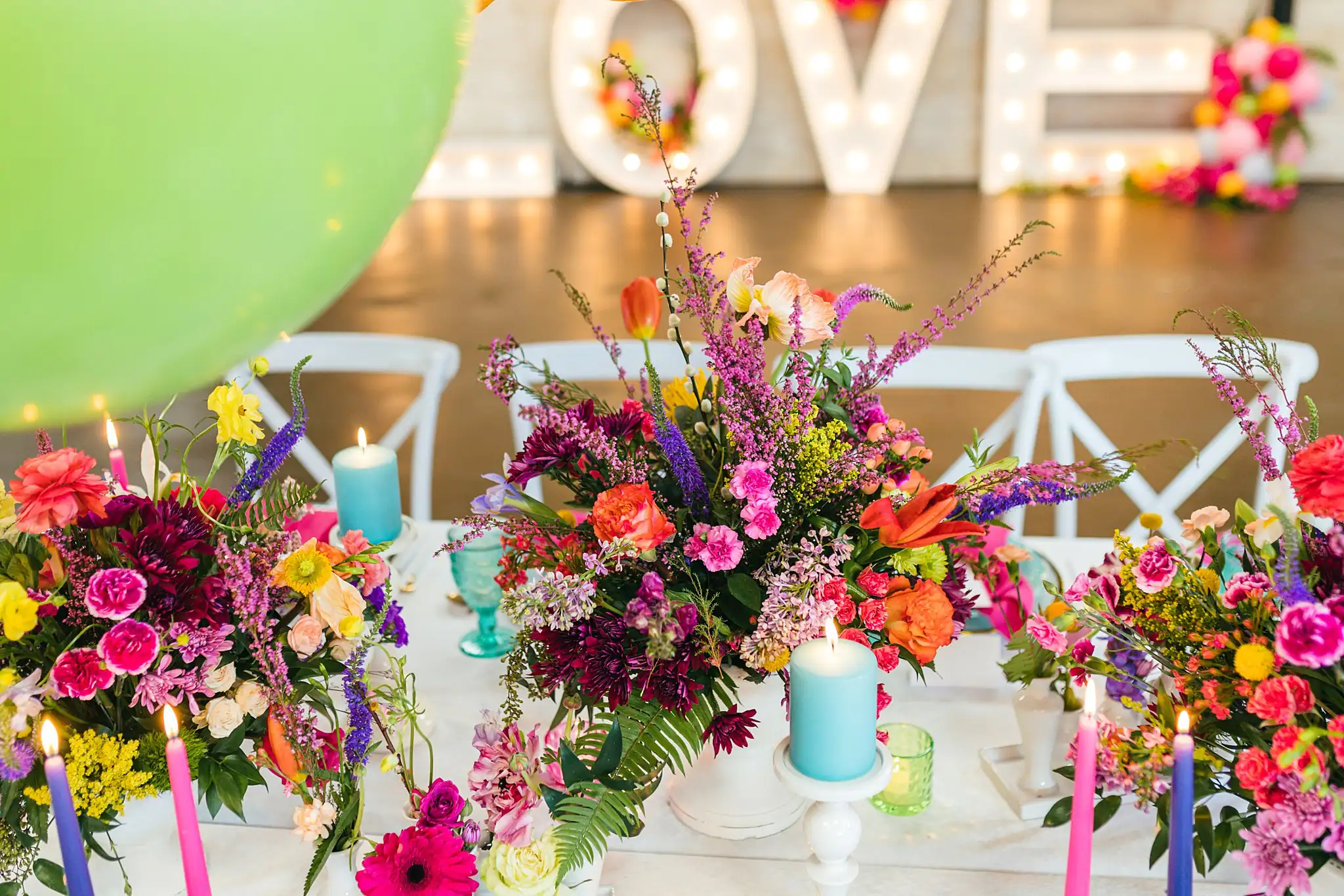 AtlantaWeddingPhotographers_1219.jpg Reception Details: the table with the LOVE letters behind, at a Whimsically in Love LGBTQ Wedding styled shoot at Brick and Ivey in Marietta, GA