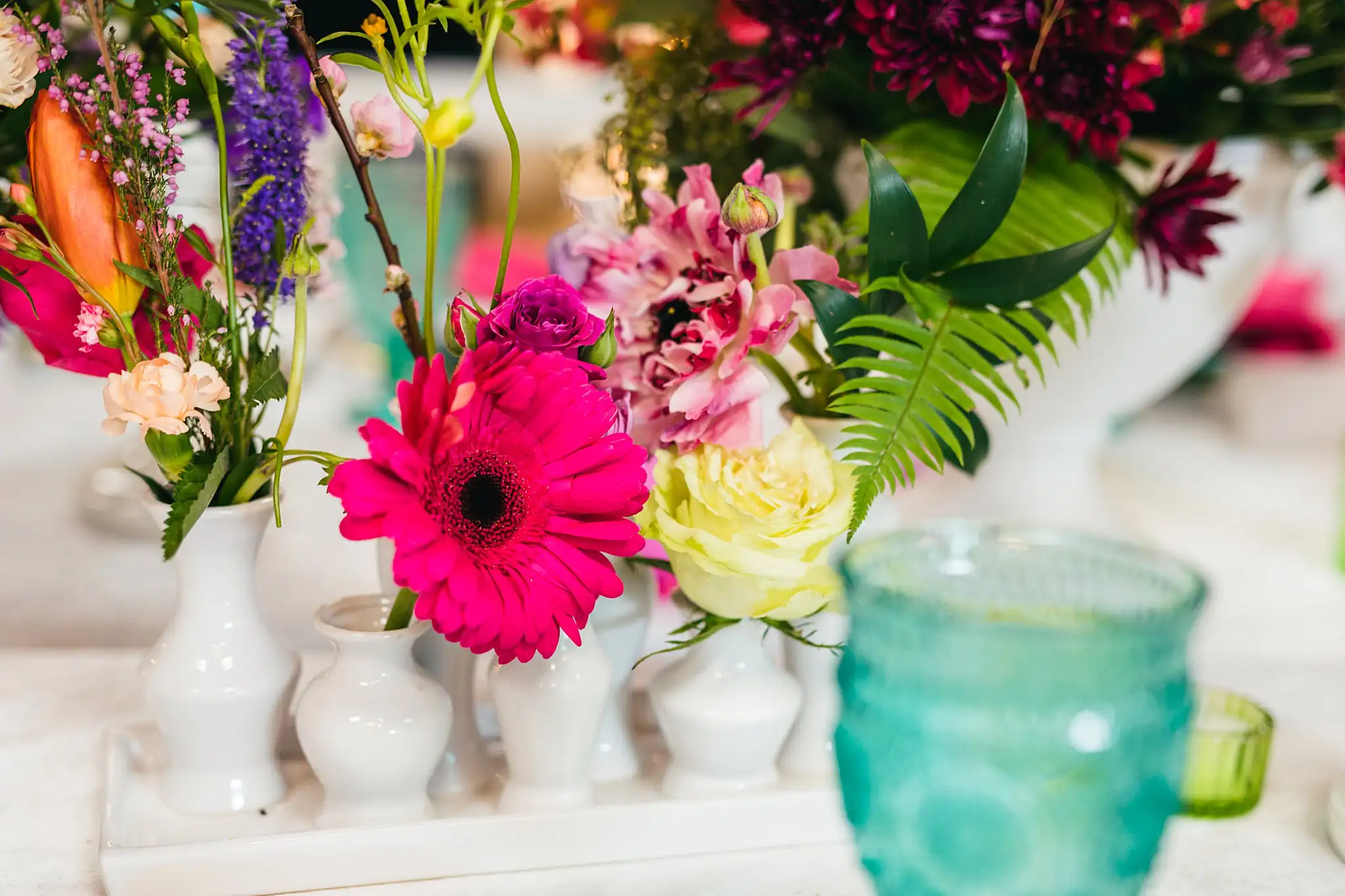 AtlantaWeddingPhotographers_1221.jpg Wedding Florals: the flowers with tapers and a teal goblet, at a Whimsically in Love LGBTQ Wedding styled shoot at Brick and Ivey in Marietta, GA