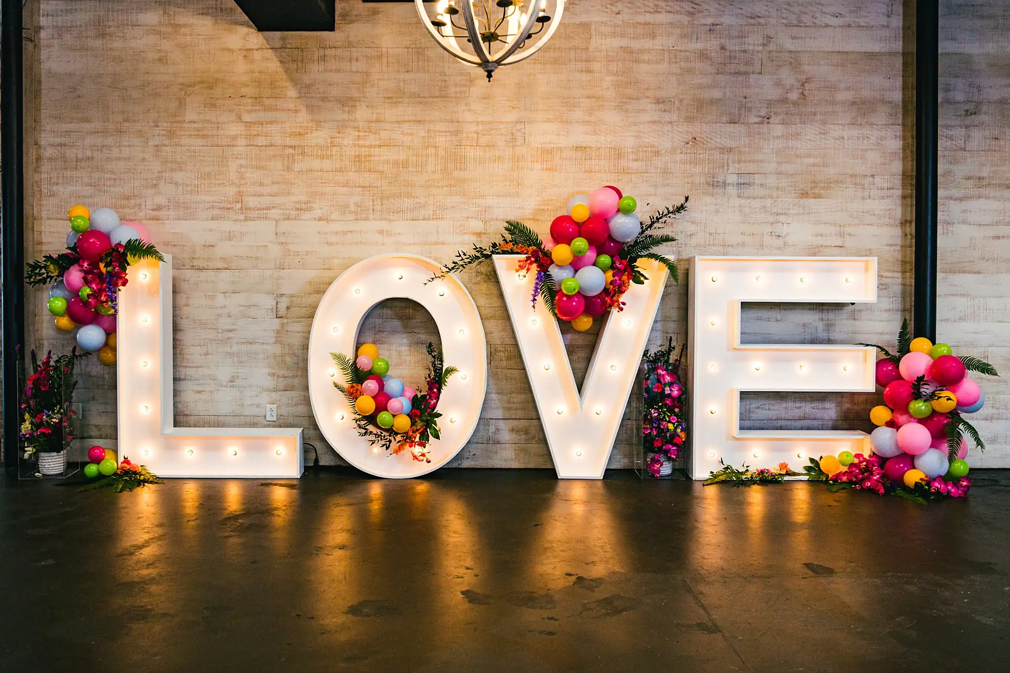 AtlantaWeddingPhotographers_1229.jpg Reception Details: the lit LOVE letters and their balloons, at a Whimsically in Love LGBTQ Wedding styled shoot at Brick and Ivey in Marietta, GA