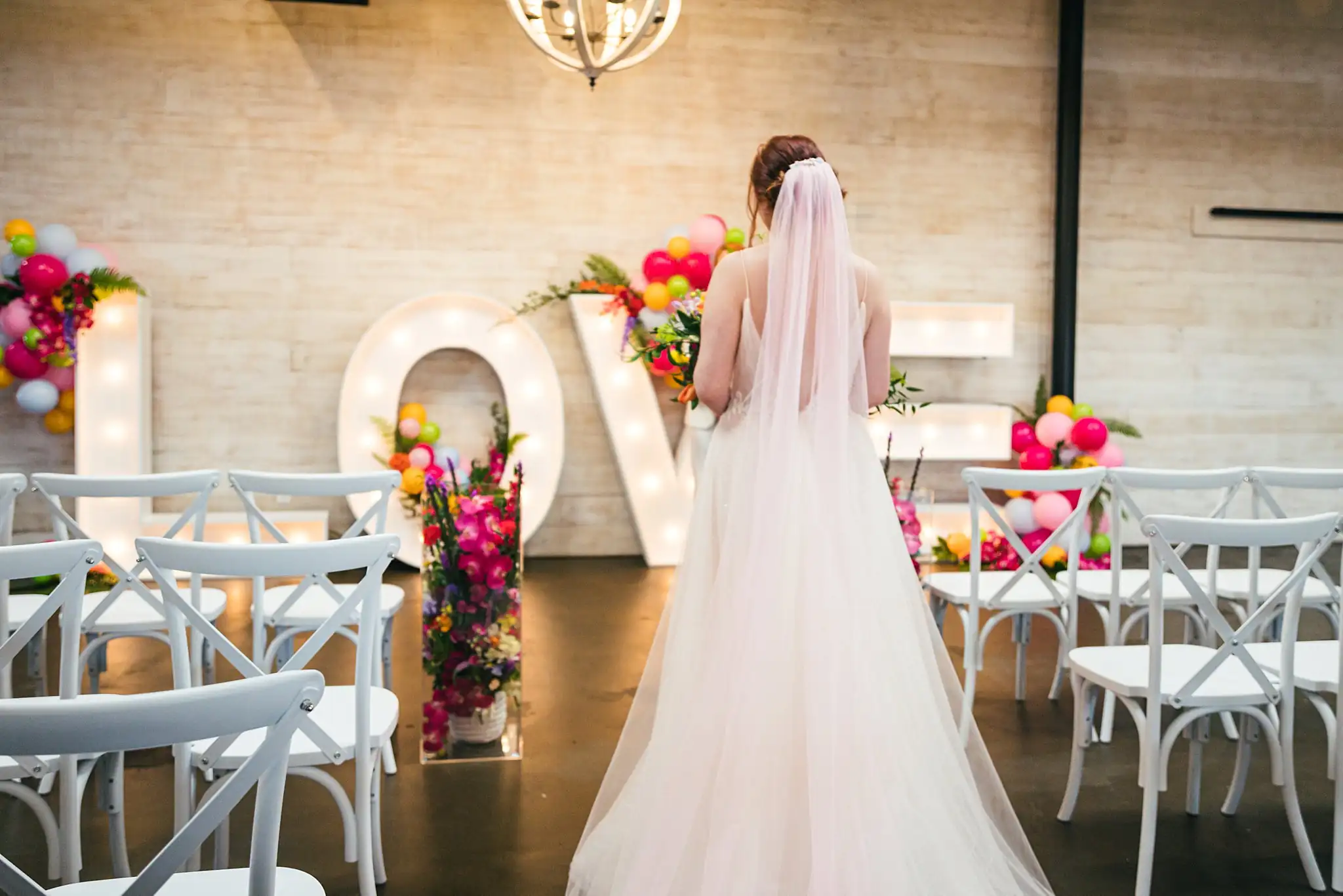AtlantaWeddingPhotographers_1230.jpg Bridal Portraits: the bride veiled at the LOVE letters, at a Whimsically in Love LGBTQ Wedding styled shoot at Brick and Ivey in Marietta, GA