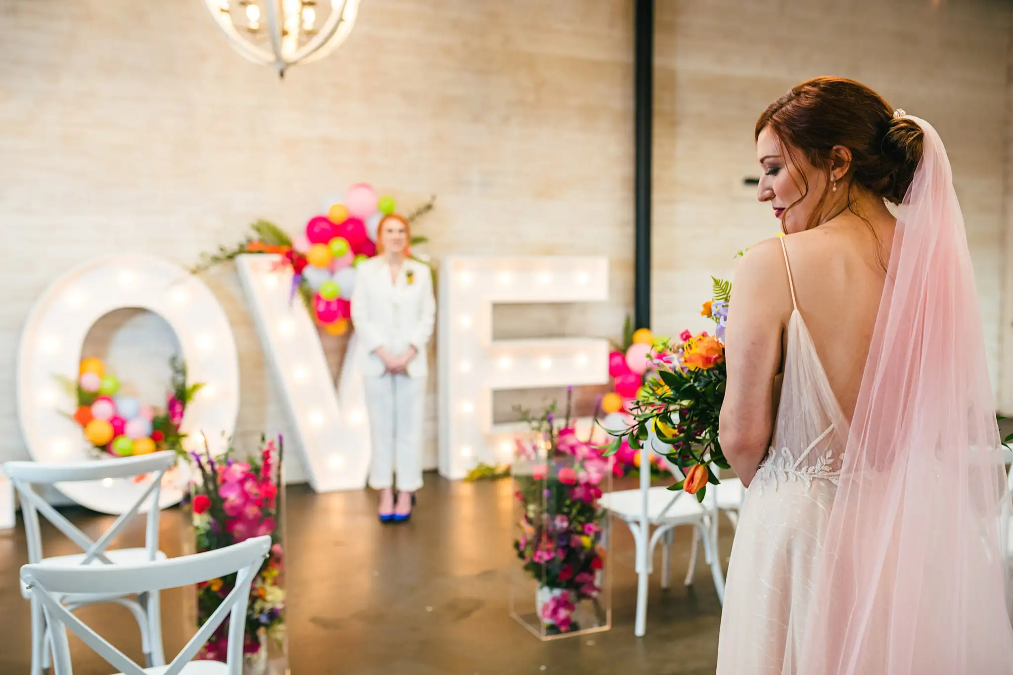 AtlantaWeddingPhotographers_1231.jpg Wedding Formals: the couple turning to each other, at a Whimsically in Love LGBTQ Wedding styled shoot at Brick and Ivey in Marietta, GA