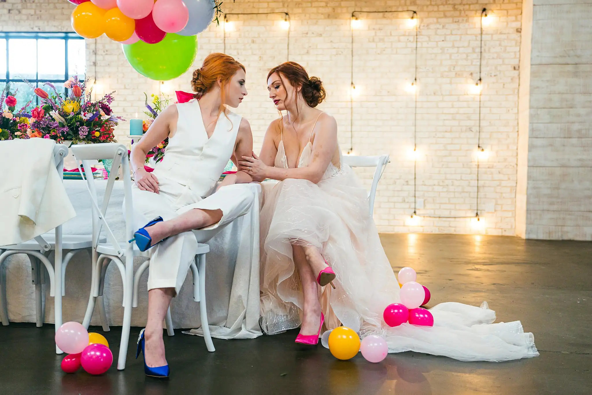 AtlantaWeddingPhotographers_1232.jpg Wedding Reception: the couple seated among the balloons, at a Whimsically in Love LGBTQ Wedding styled shoot at Brick and Ivey in Marietta, GA