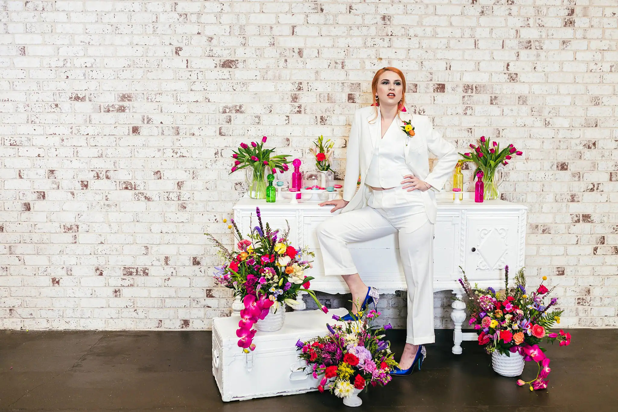 AtlantaWeddingPhotographers_1240.jpg Bridal Portraits: the bride in the suit among the flowers, at a Whimsically in Love LGBTQ Wedding styled shoot at Brick and Ivey in Marietta, GA
