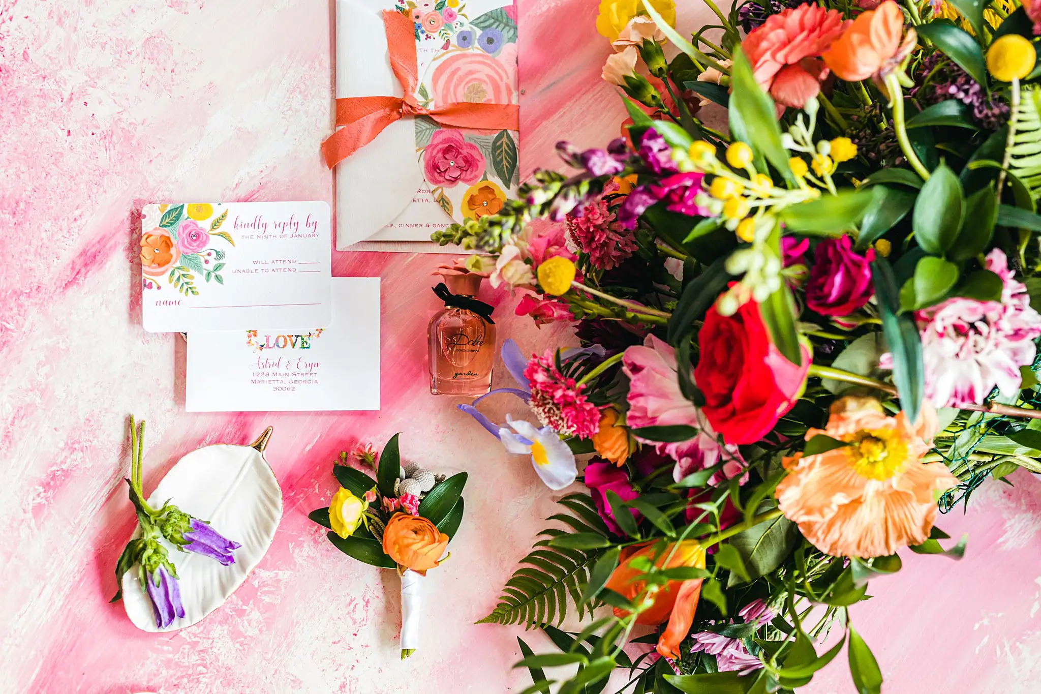 AtlantaWeddingPhotographers_1252.jpg Wedding Details: the invitation and flowers laid on pink, at a Whimsically in Love LGBTQ Wedding styled shoot at Brick and Ivey in Marietta, GA